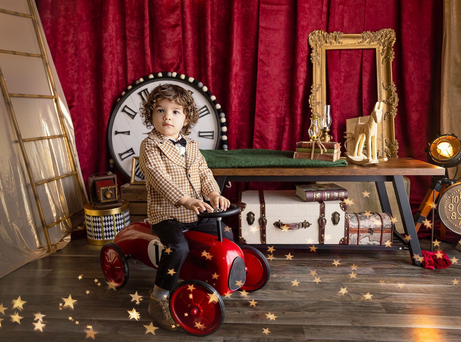 Gold and red decoration for baby images in Ponce Puerto Rico, little boy two year old is seen riding a red car.