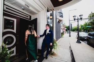 A series of candid moments captured at a wedding venue showing guests and architectural details in black and white.