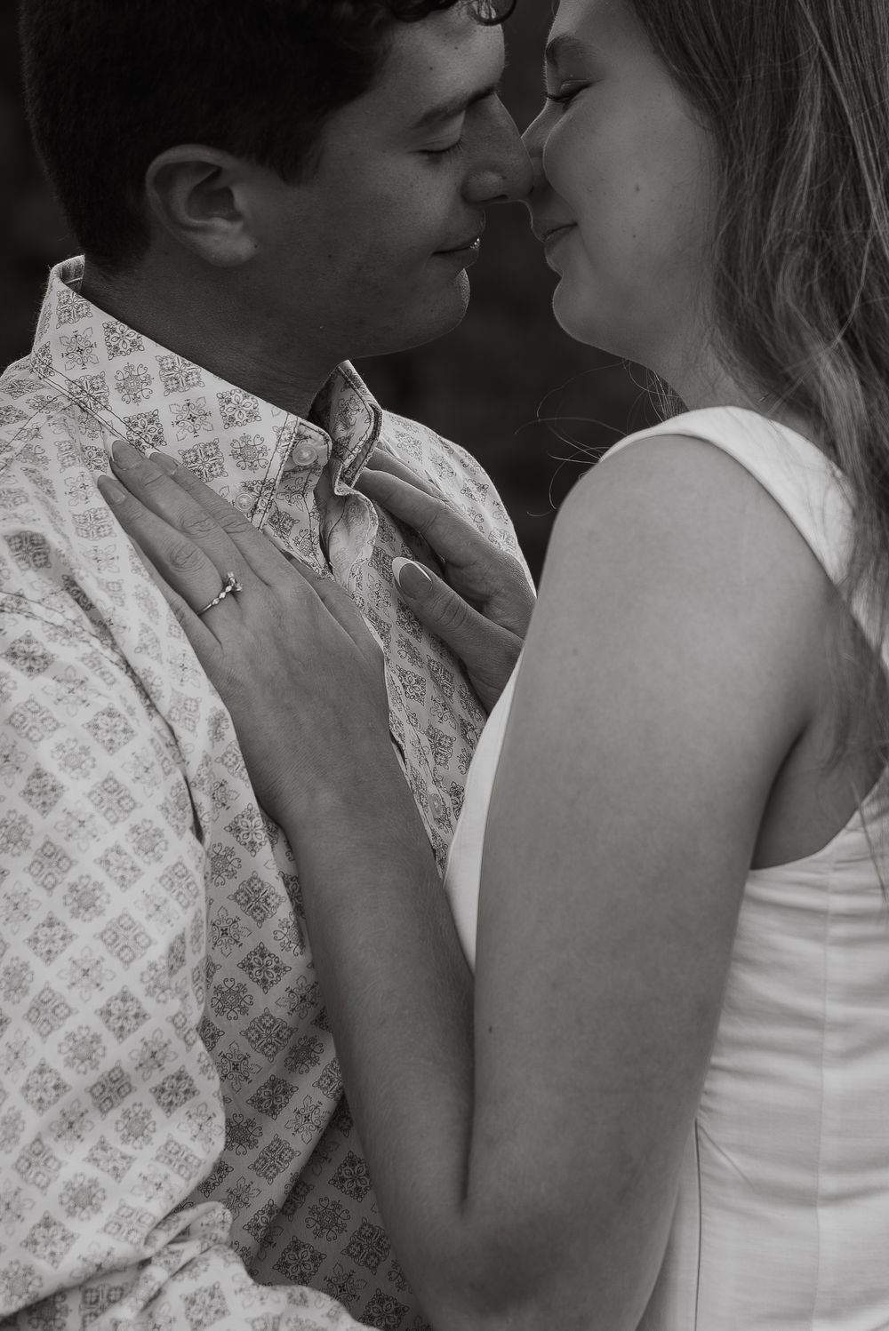 A romantic close-up sequence of a couple sharing intimate moments against a light background.