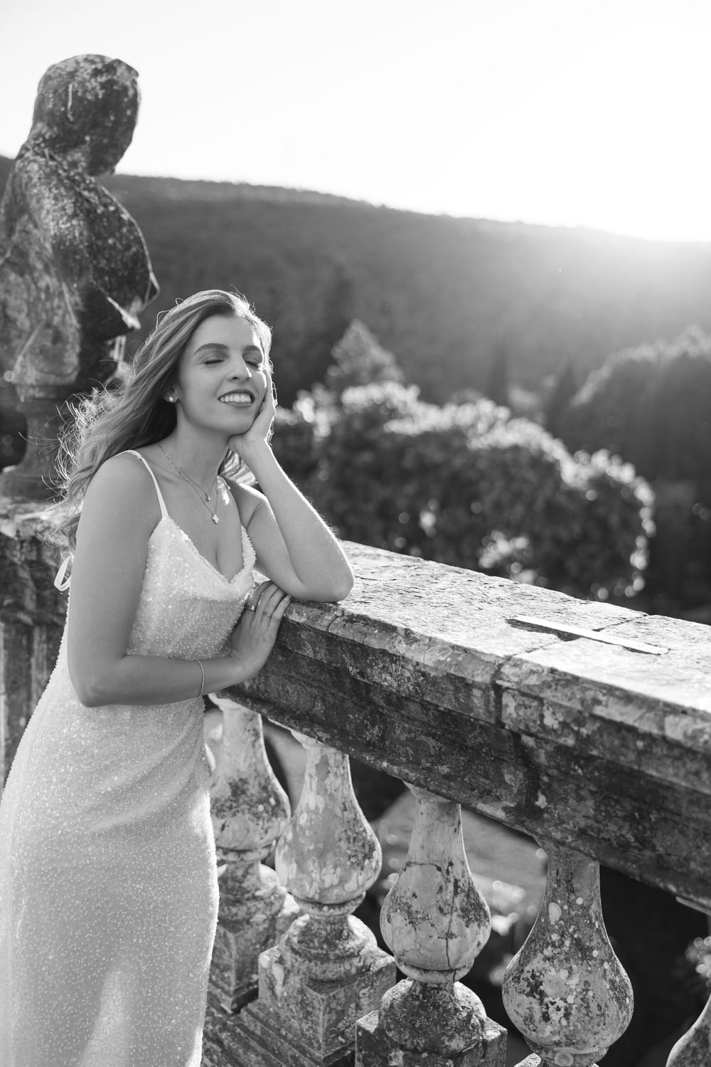 Black and white artistic shots taken against a stone balcony with scenic mountain views.