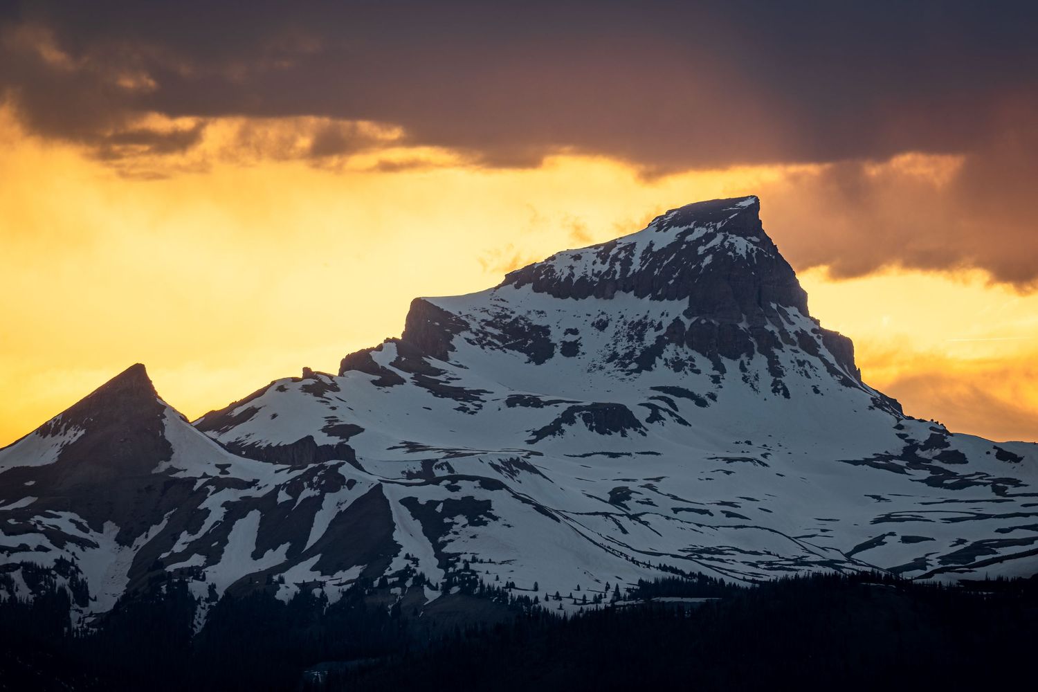 A break in the clouds at the end of sunset perfectly framed Uncompahgre Peak in Lake City, Colorado.