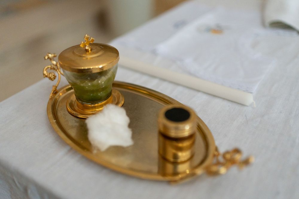 Golden tea set with delicate cups and saucers arranged on elegant tray.
