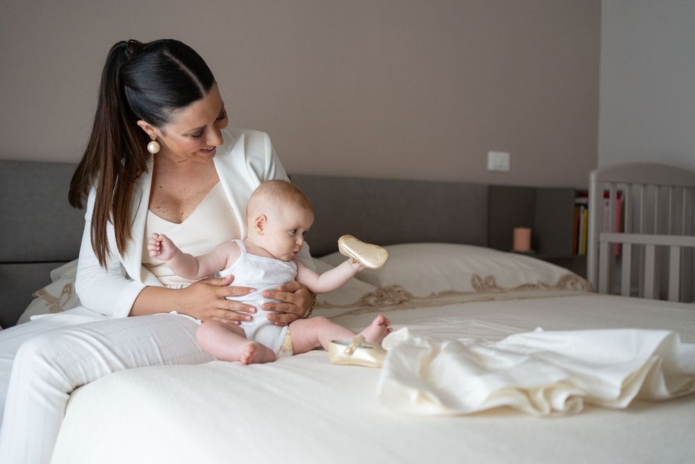 Intimate bedroom setting with soft lighting and white bedding creating a cozy atmosphere.