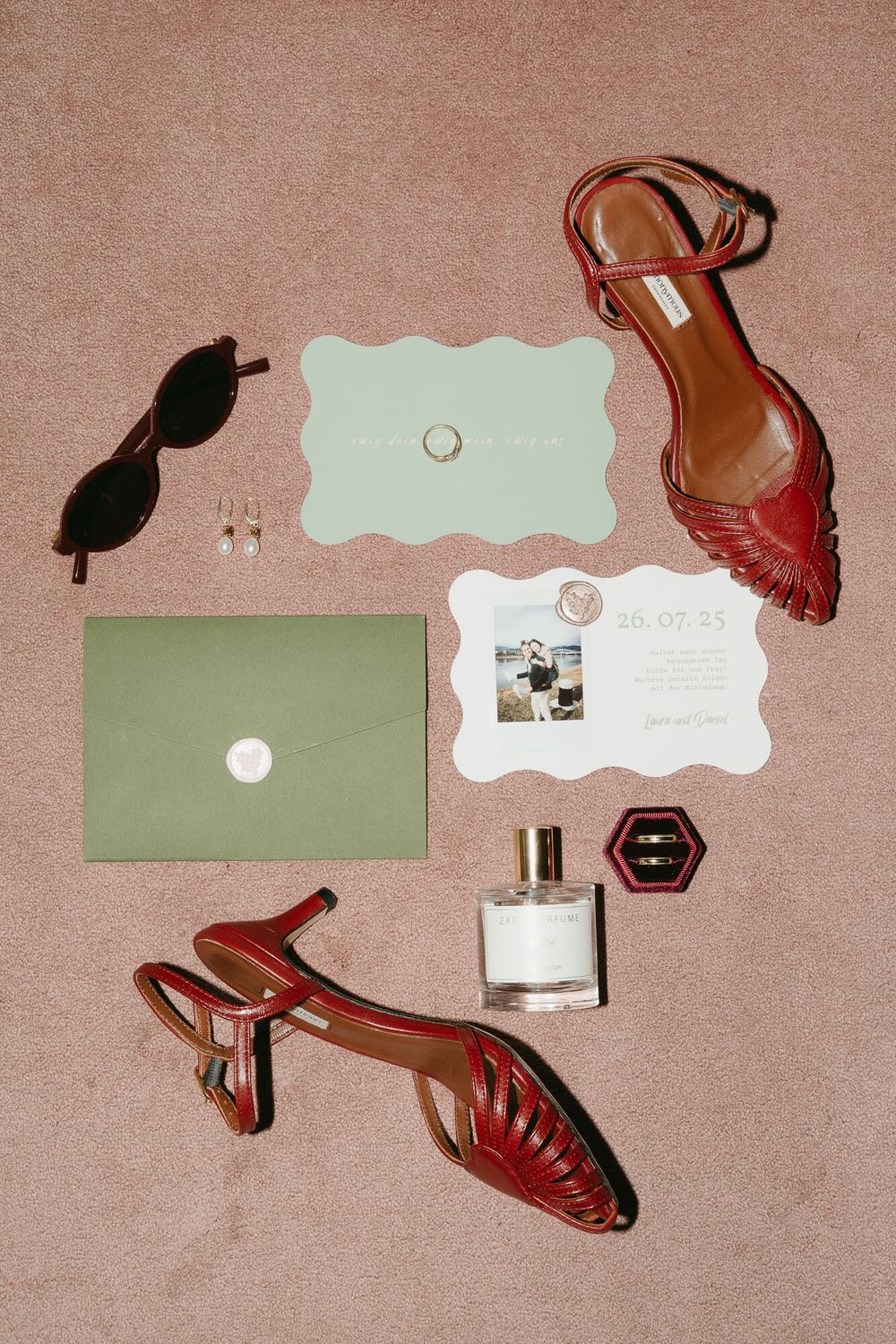 A collection of brown leather shoes and paper cards arranged artistically on a beige textured background.