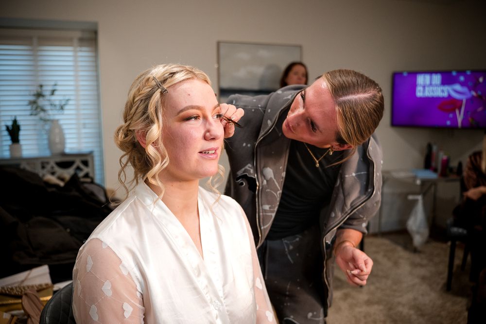Behind-the-scenes preparation shots showing someone in a white robe in an indoor setting with window light.