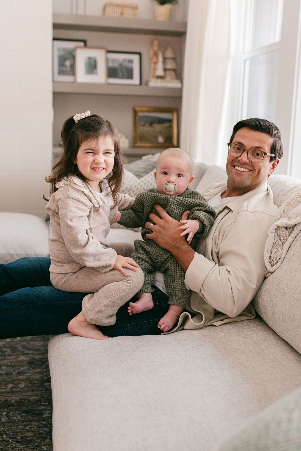 A heartwarming series of candid moments between family members relaxing together on a cozy beige couch.
