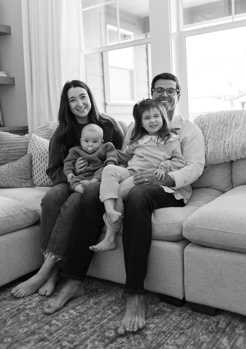 A family relaxes together on a light gray couch in a bright living room showing progression across multiple frames.
