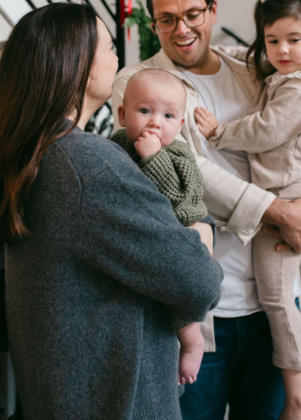 Intimate family moments captured in a series of casual indoor portraits.