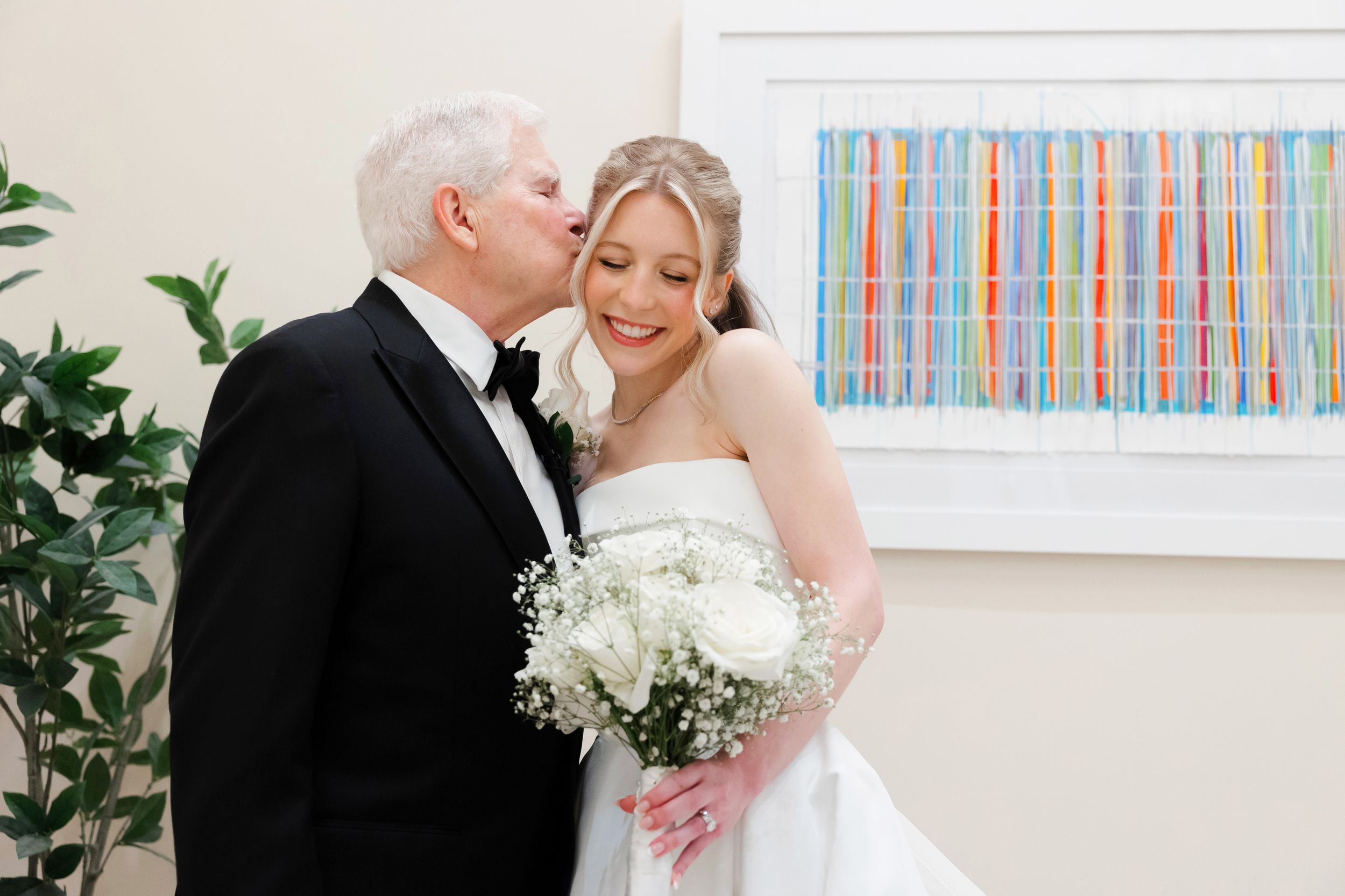 Father kissing bride at BallenIsles Country Club in Palm Beach during a wedding photographed by Ohio photographer Tom Forrest.