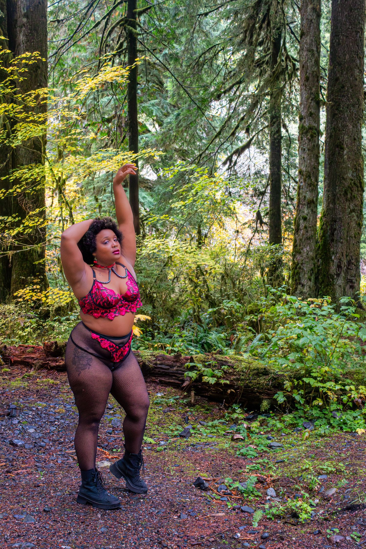 A sequence of dance poses performed in a lush green forest setting with trees and foliage in the background.