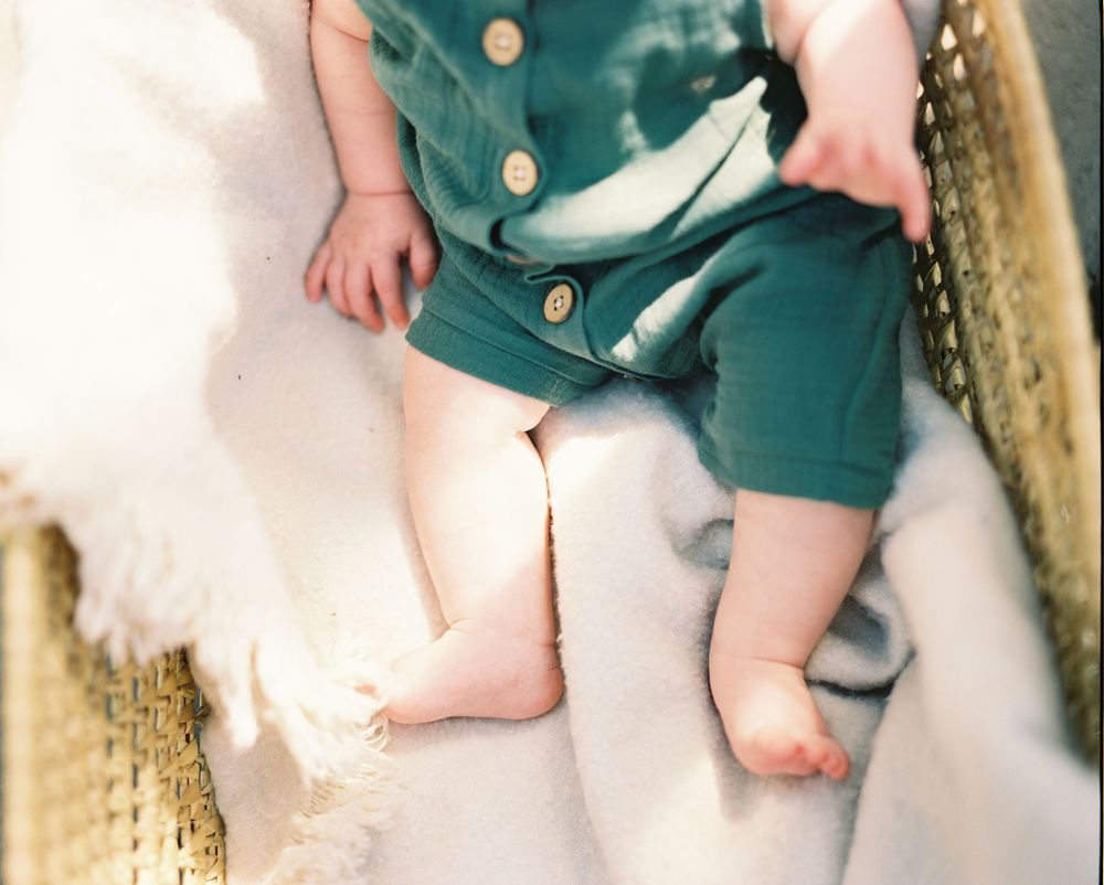 Close-up view of bare feet against a soft white background.