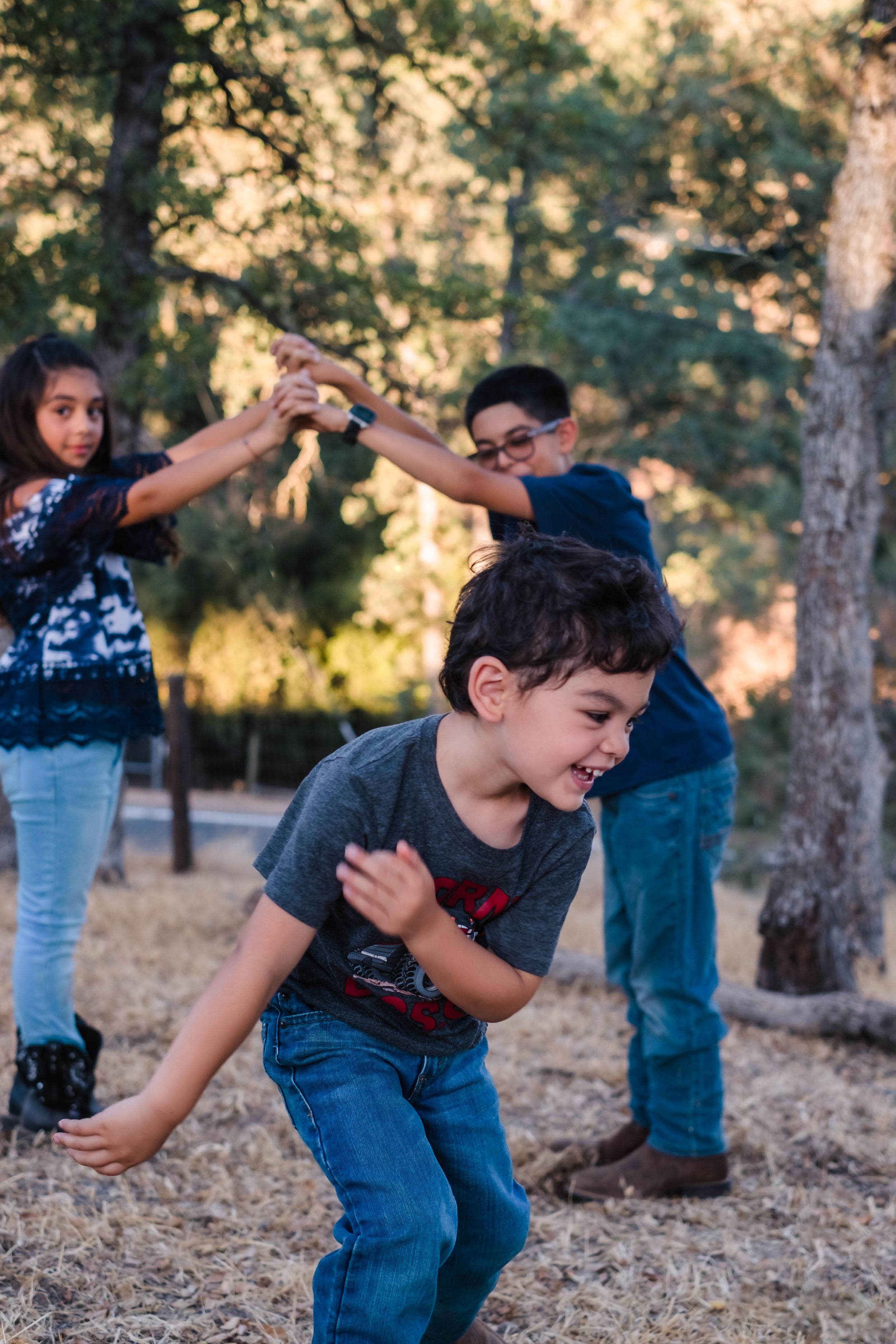 A sequence of photos shows a child in blue jeans and dark shirt laughing and playing in their front yard in valley springs ca