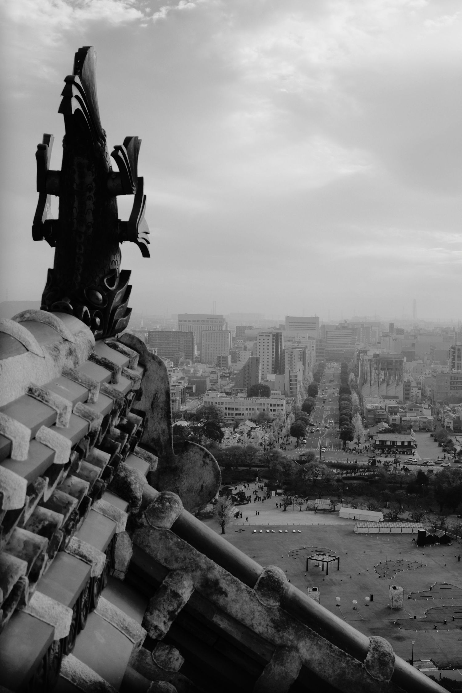 A sequence of black and white photographs showing a cityscape view with industrial buildings and urban development.