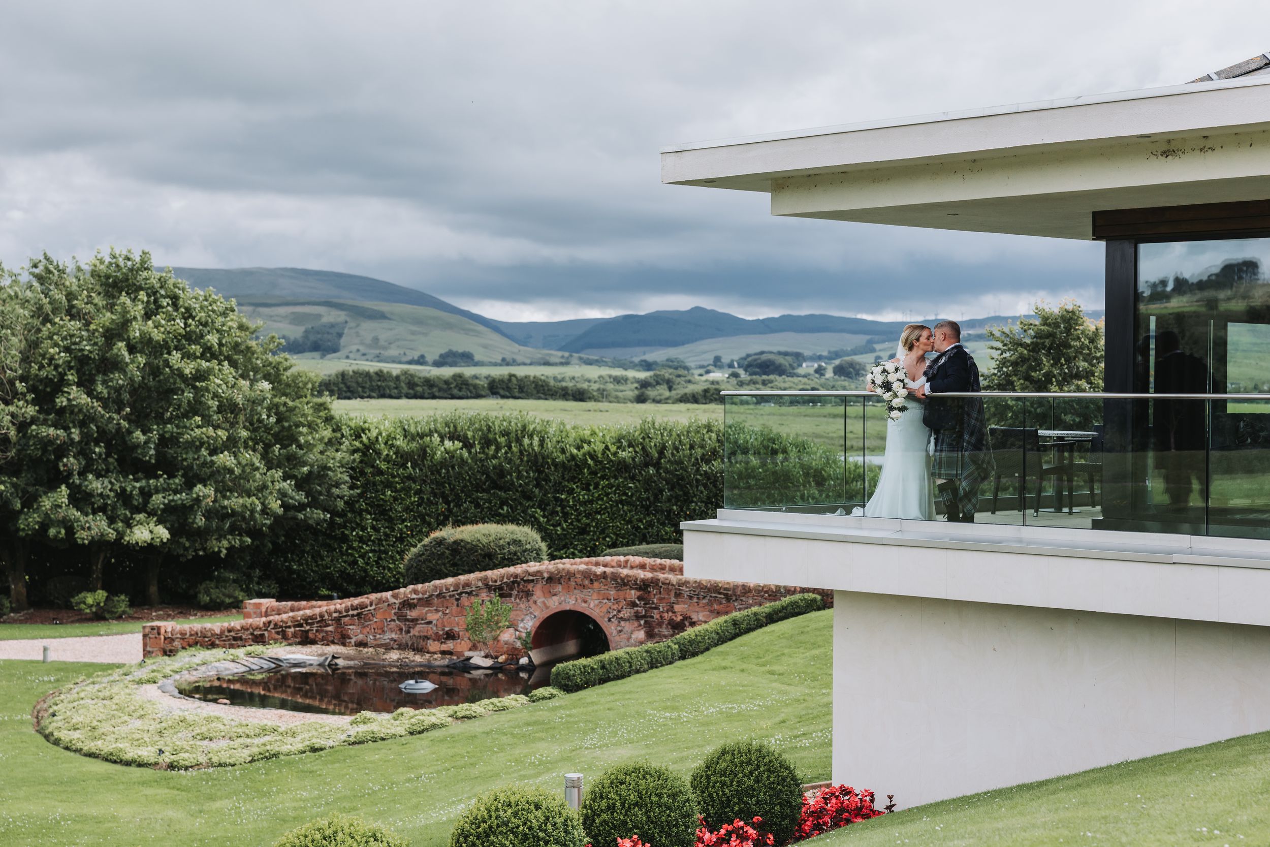 Modern venue with scenic mountain views and elegant white architecture.