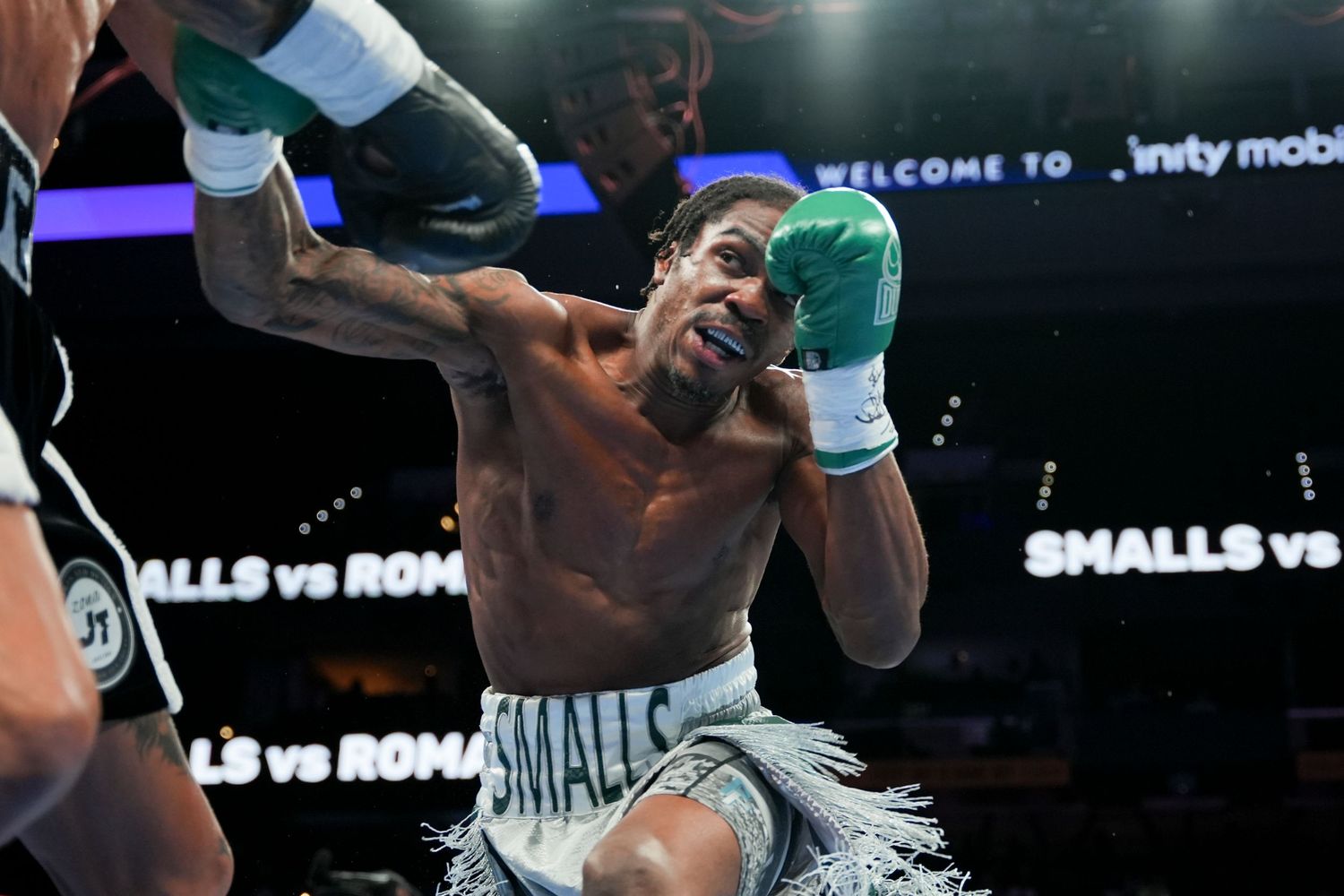 A close-up of boxer Smalls in an aggressive stance during the Smalls vs Roman boxing match.
