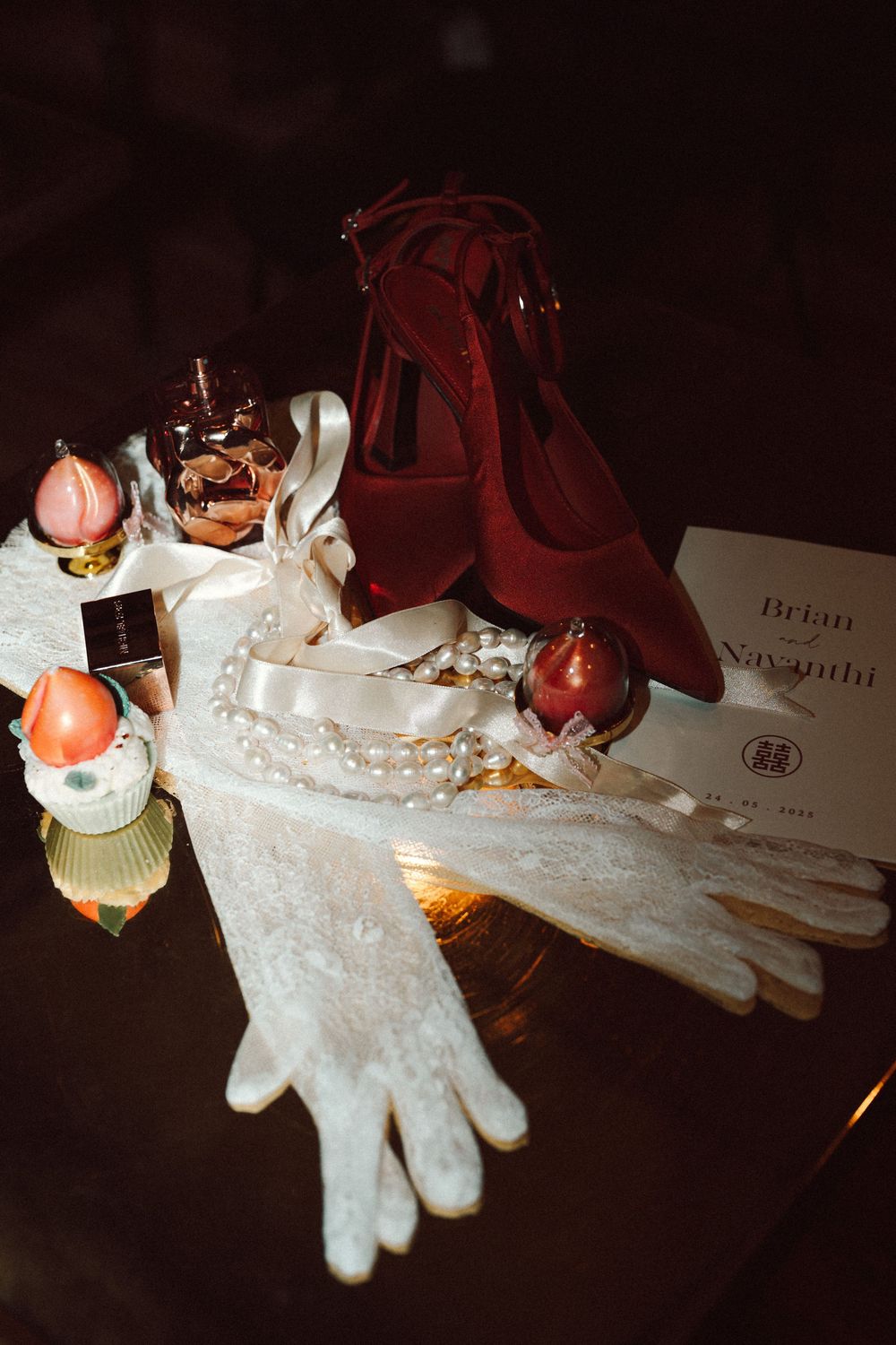 White winter gloves decorated with sparkling sequins and ornaments create a festive holiday display.