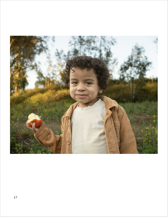 a young boy eating a apple