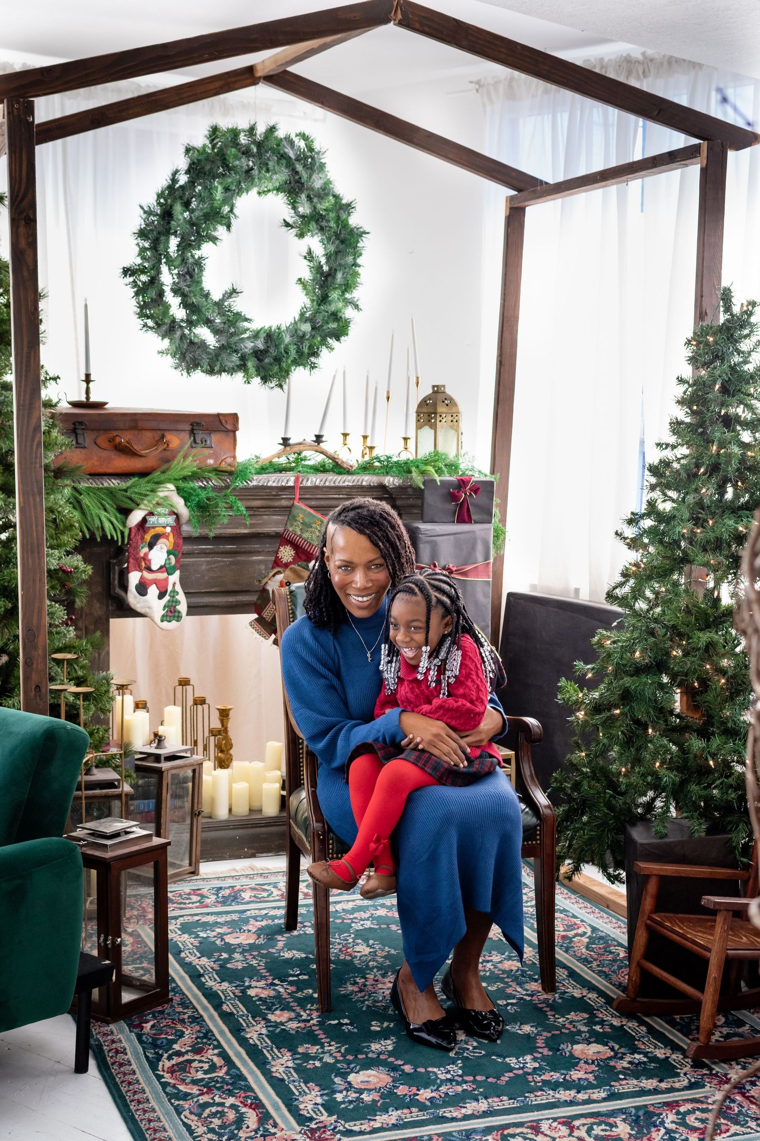 Holiday family portrait in Tacoma with grandmother and child in festive tree decor