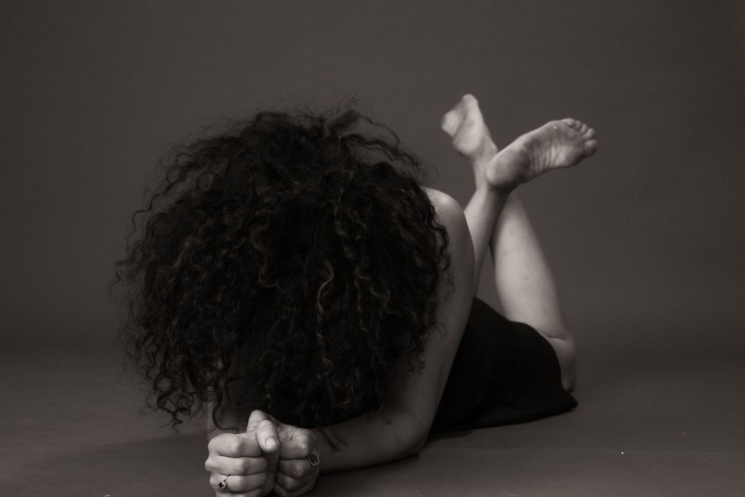 A dramatic black and white dance performance sequence showing graceful movement and artistic expression.