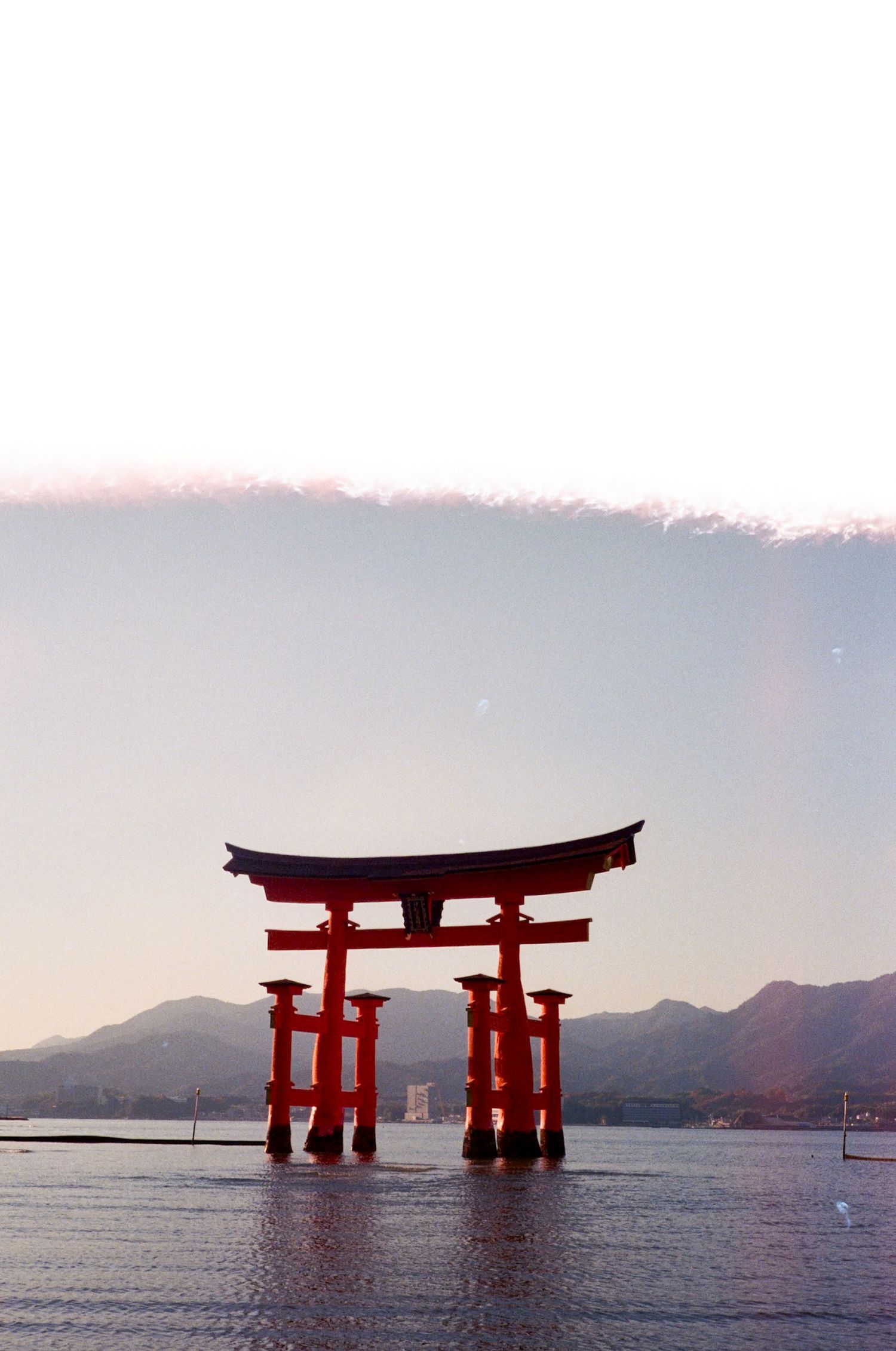 The iconic Itsukushima floating torii gate stands majestically in the water at different tide levels off Miyajima Island, Japan.
