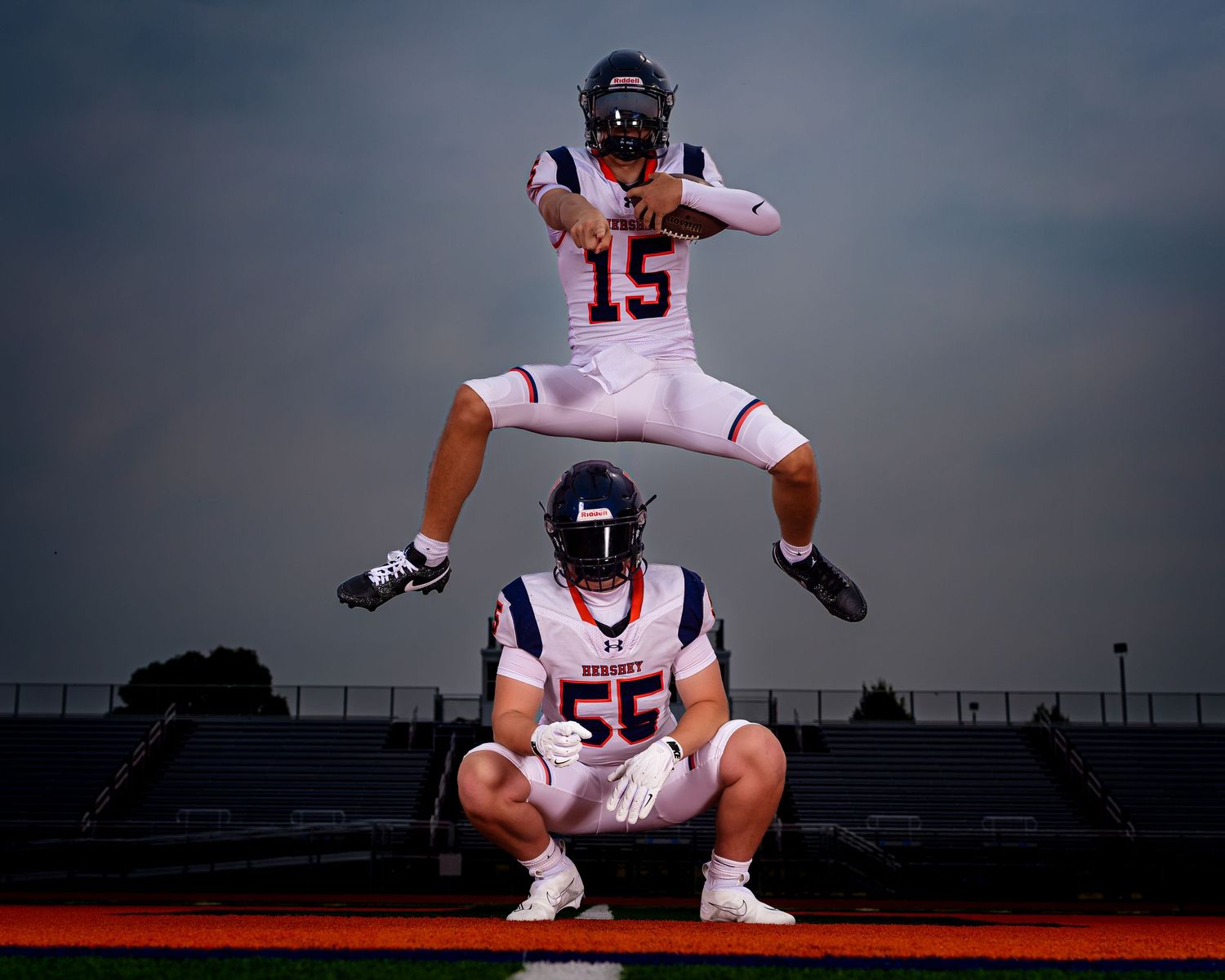 Hershey Trojans football, #15 and #55, stacked jumping pose, Media Day, by Deanna Fox, SportsFox Photography based in Hershey PA