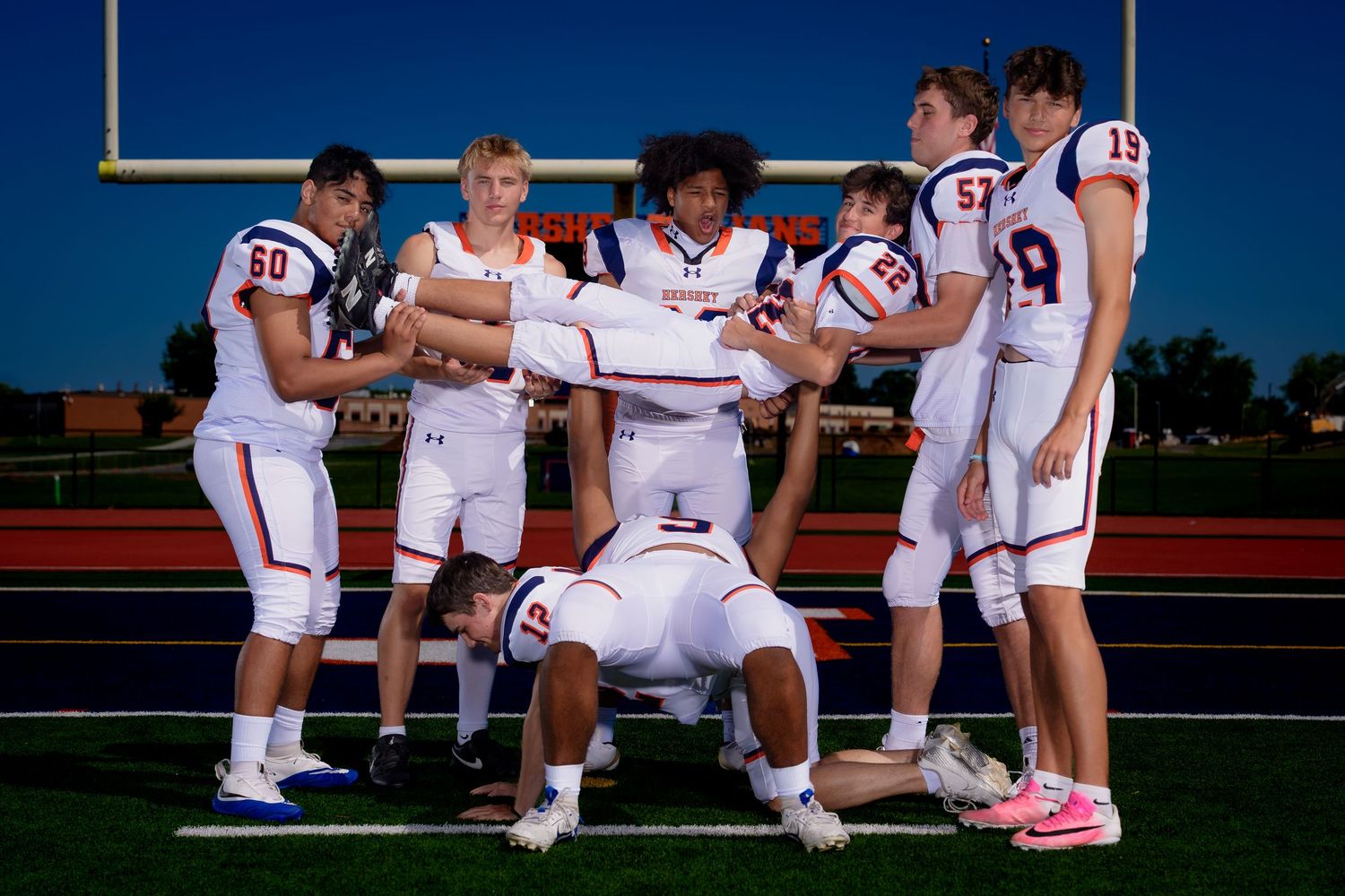 Hershey Trojans football senior class, playful group pose, Media Day, by Deanna Fox, SportsFox Photography based in Hershey PA