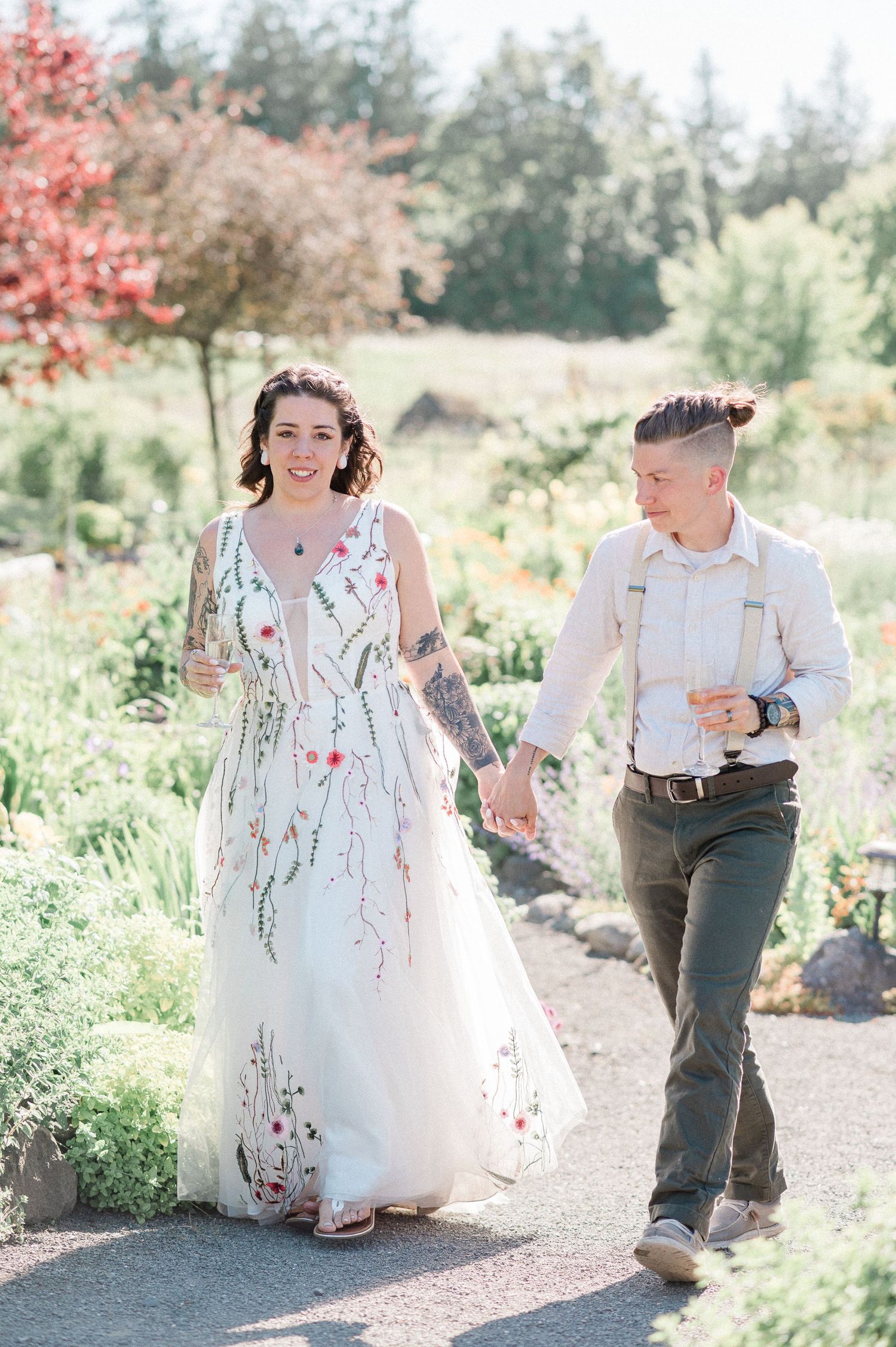 queer couple walking hand in hand at Nourish Restaurant in Sequim, WA
