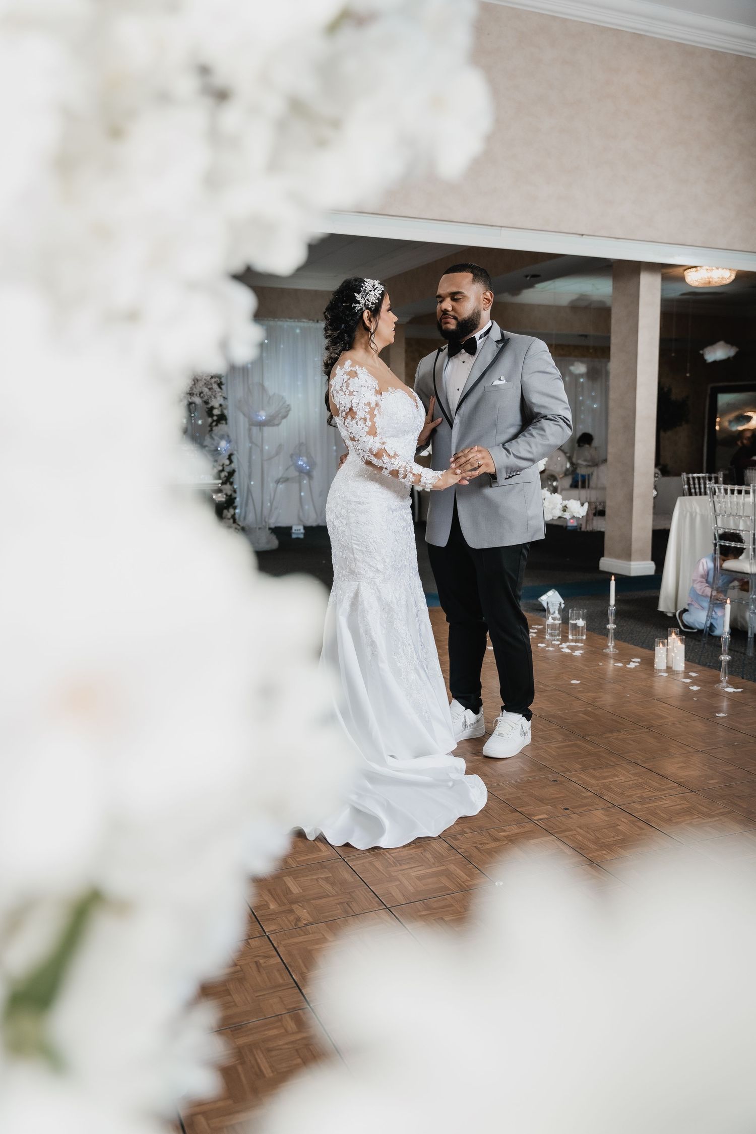 A bride and groom share a romantic moment on the dance floor during their wedding reception.