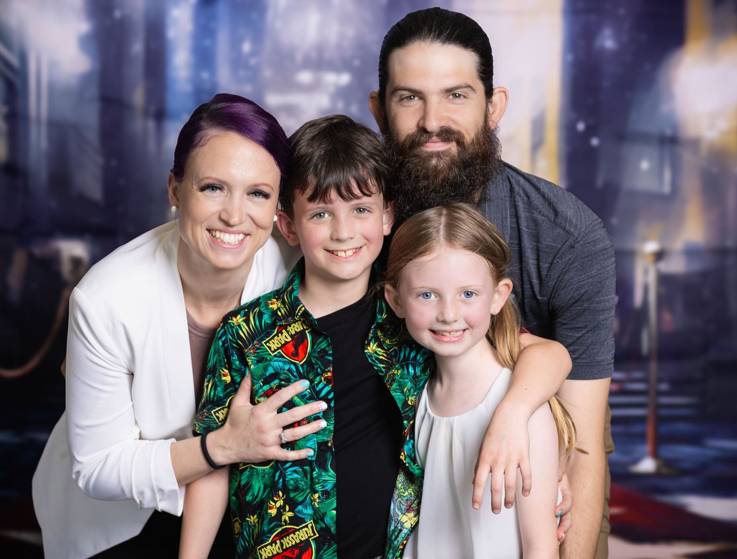 Studio portrait with fantasy cityscape background featuring festive holiday attire.