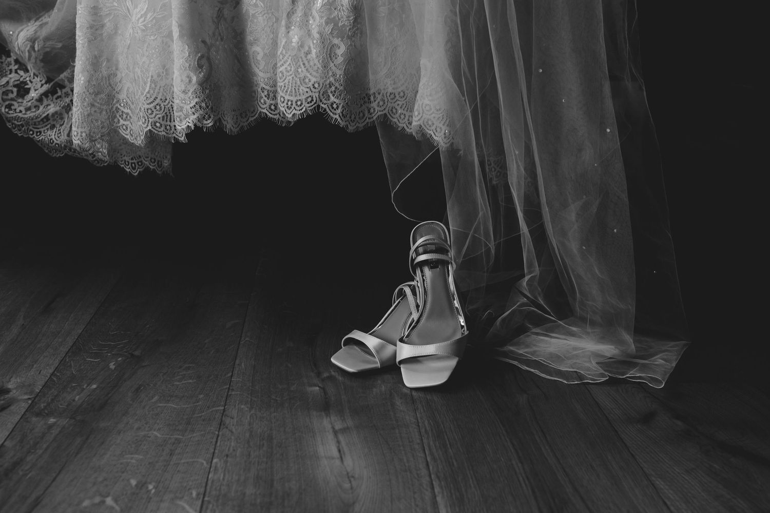 Fine details of the bride’s dress and shoes, photographed naturally and elegantly.
