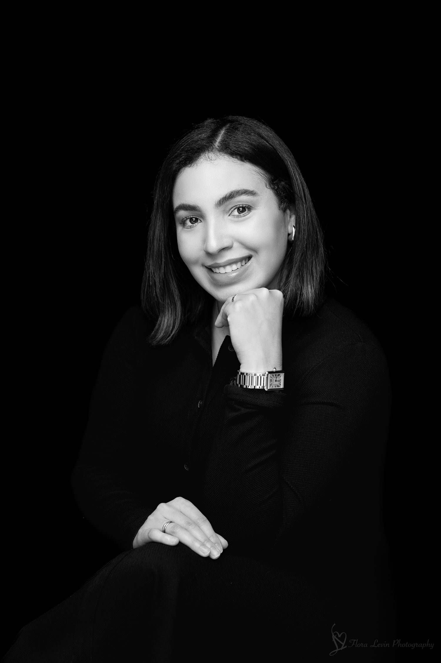 A black and white portrait photo collage showing elegant studio shots with dark backgrounds and soft lighting effects.