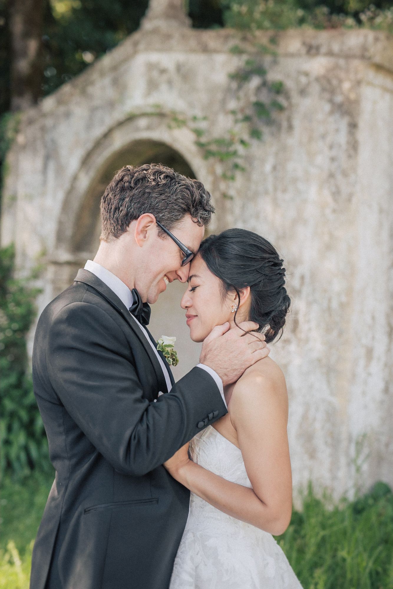 A romantic wedding portrait of a couple sharing an intimate moment at penha longa. Captured in Portugal by a destination wedding photographe