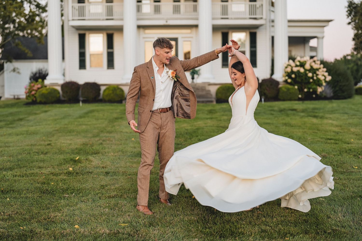 Buffalo NY wedding portrait golden hour of couple dancing