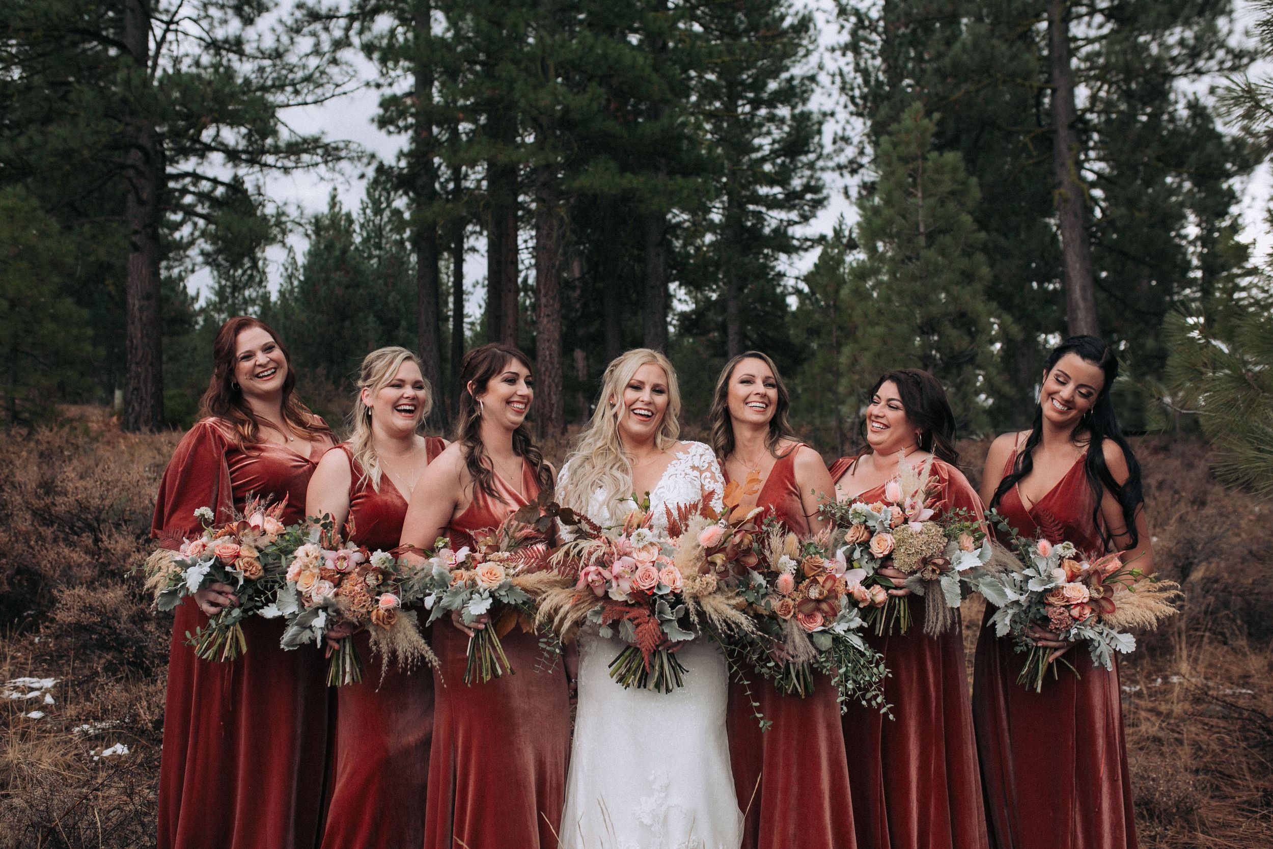 Wedding layflat with invitations, rings, and flowers styled for bridal details