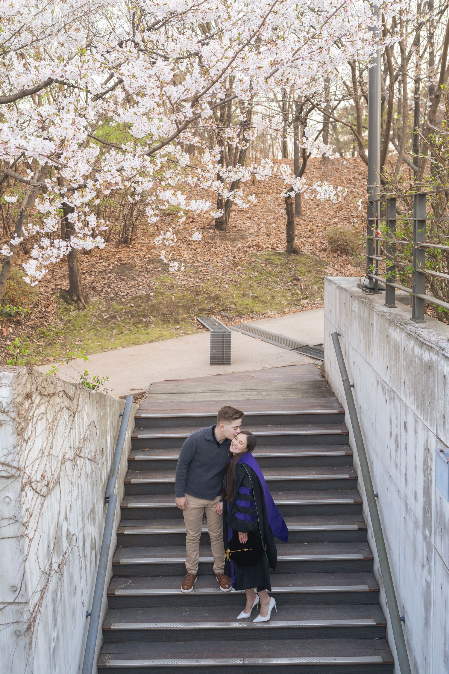 A series of photos showing a person sitting on concrete stairs with cherry blossoms visible in the background.