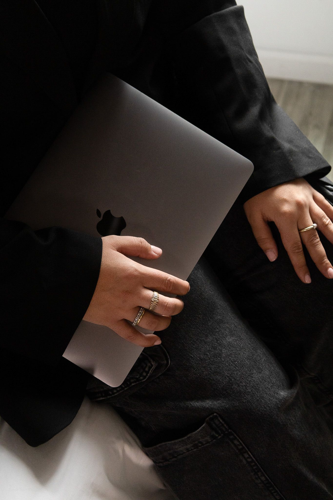 Closeup of woman holding MacBook with rings, personal branding photography for entrepreneurs in Pittsburgh by Camille Cupid content creation