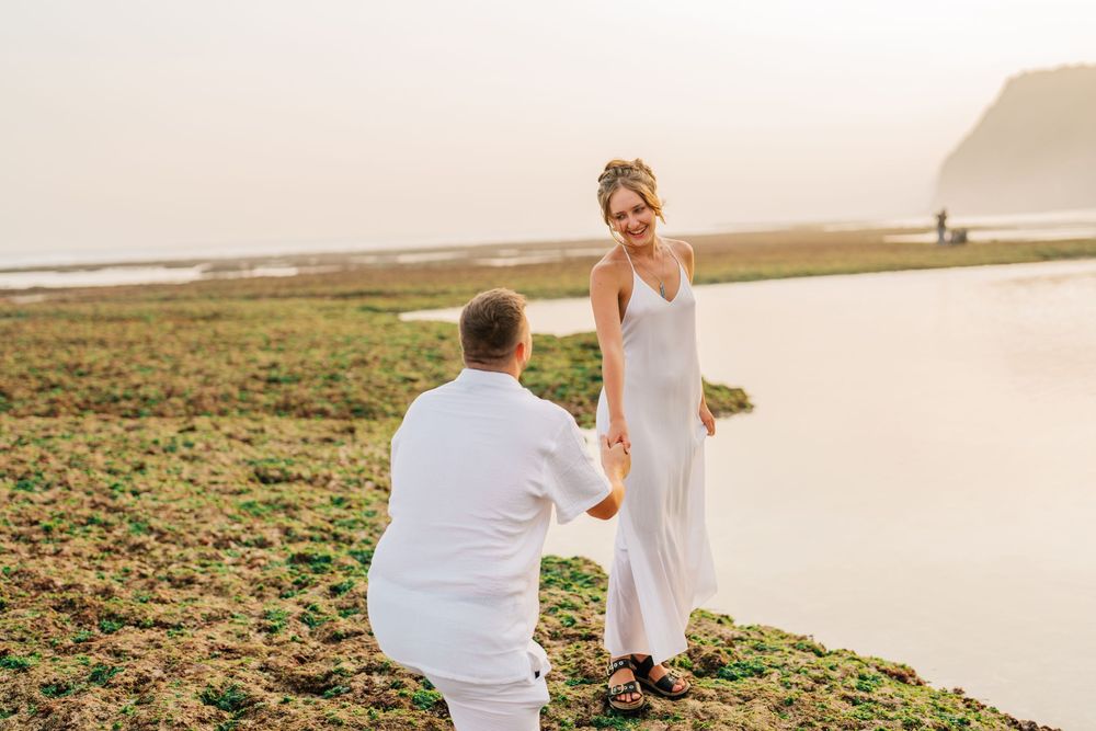 A romantic beachside moment captured during golden hour.