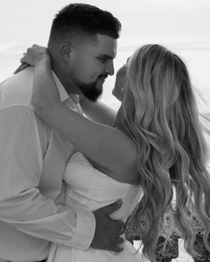 Black and white romantic portraits of couple embracing and dancing together.