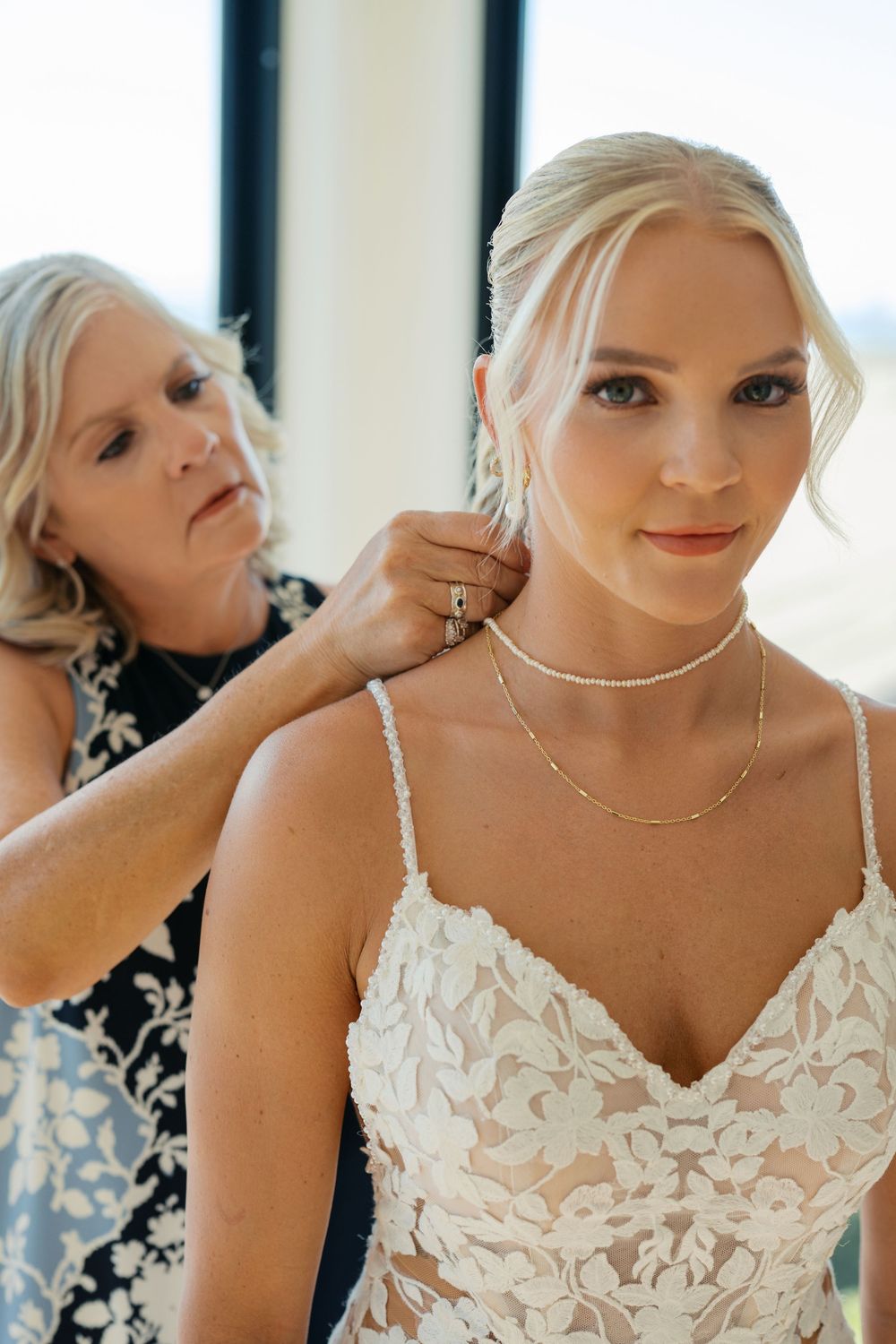 A close-up portrait series showing a bride in a white lace wedding dress with sweetheart neckline in natural lighting.