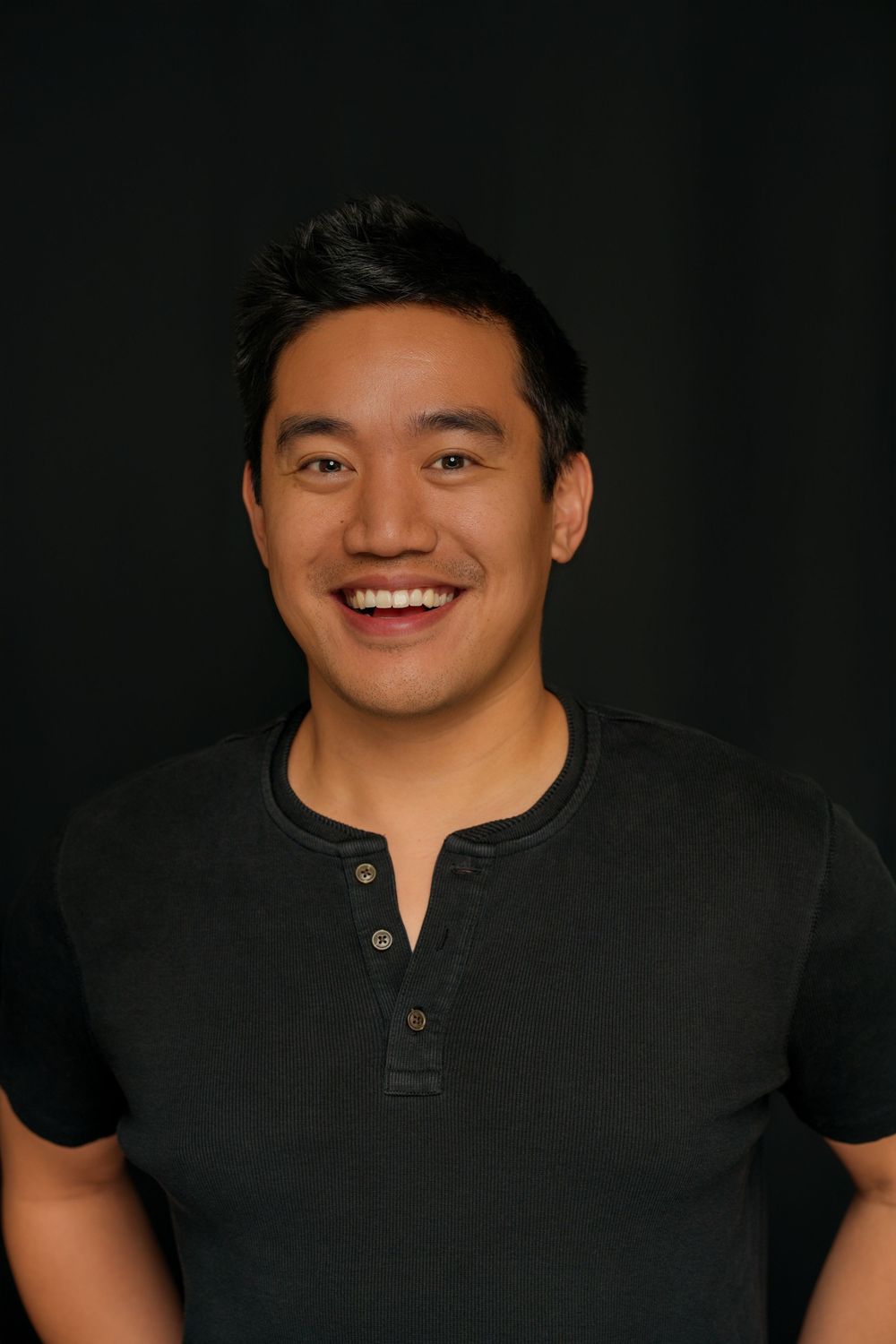 Portrait photos of a smiling person wearing a black polo shirt against a dark background.