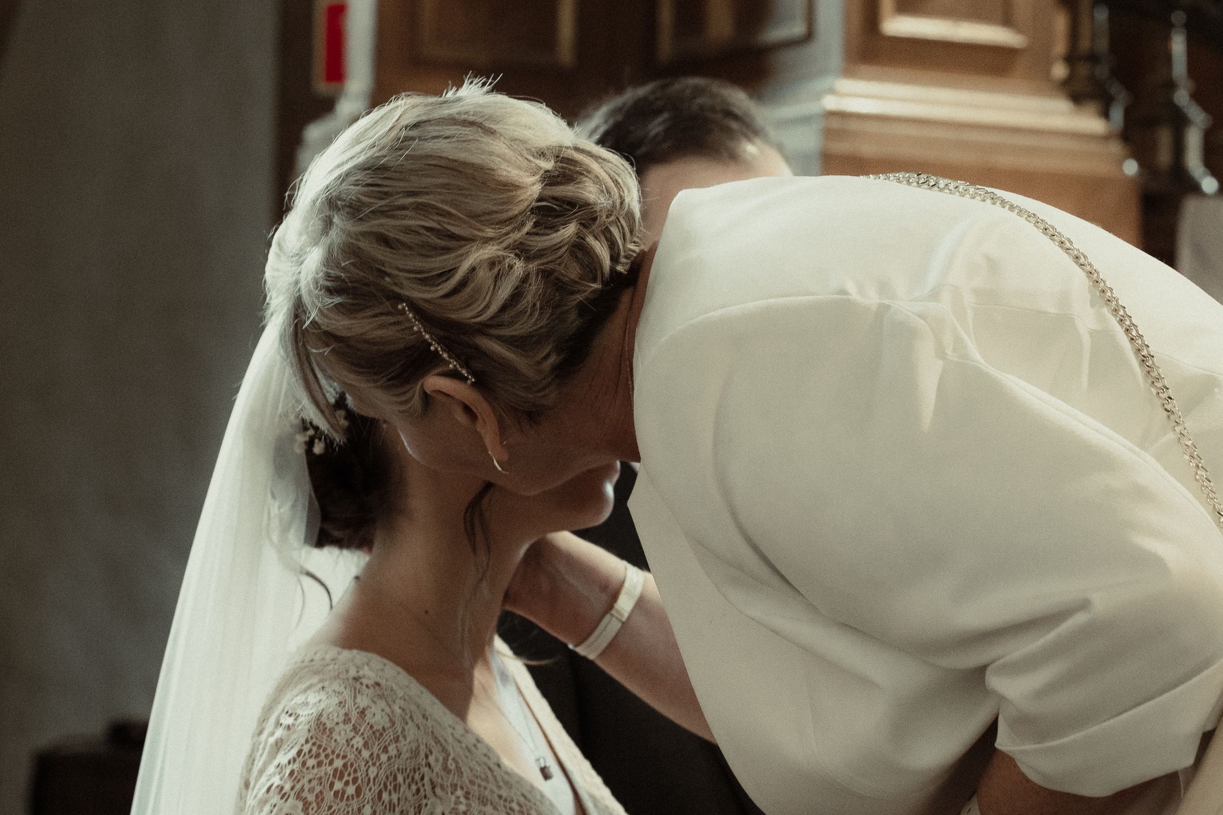 A sequence of wedding preparation moments shows a bride getting ready with hair and makeup styling at a venue.