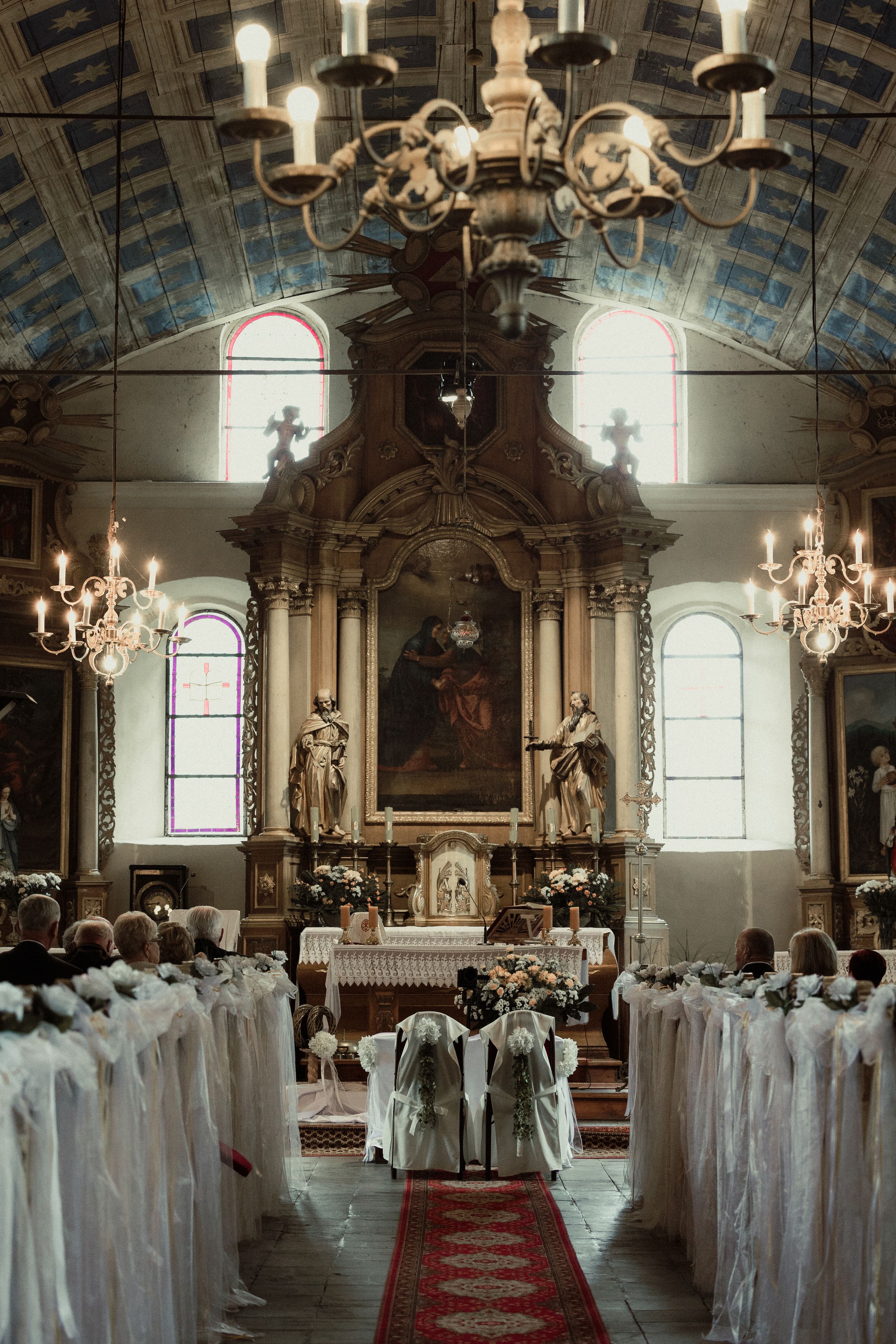 A sequence of chapel interior photos showing a religious ceremony with figures in white robes standing in rows.