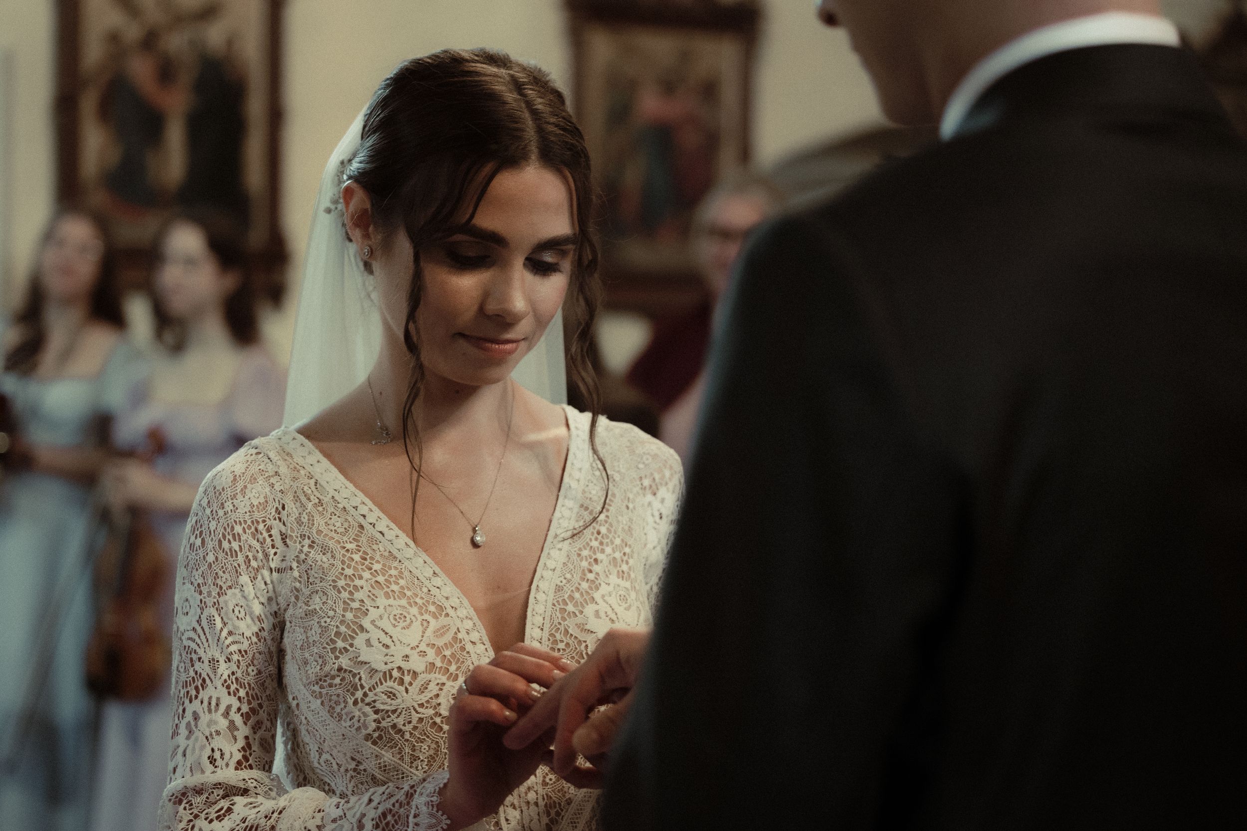 A stunning church interior decorated for an elegant wedding ceremony with soft lighting and traditional decor.