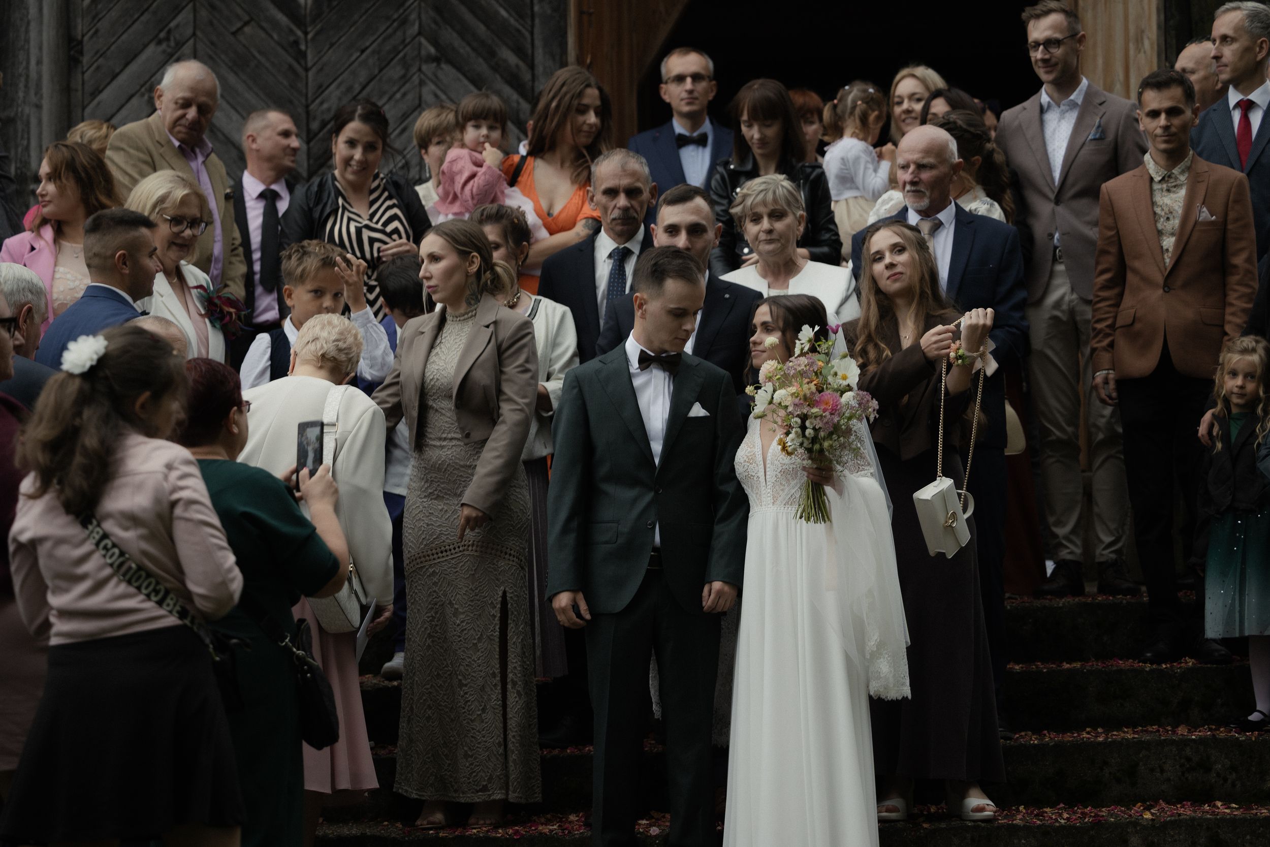 A collection of black and white photographs showing groups of formally dressed people at what appears to be a church event.