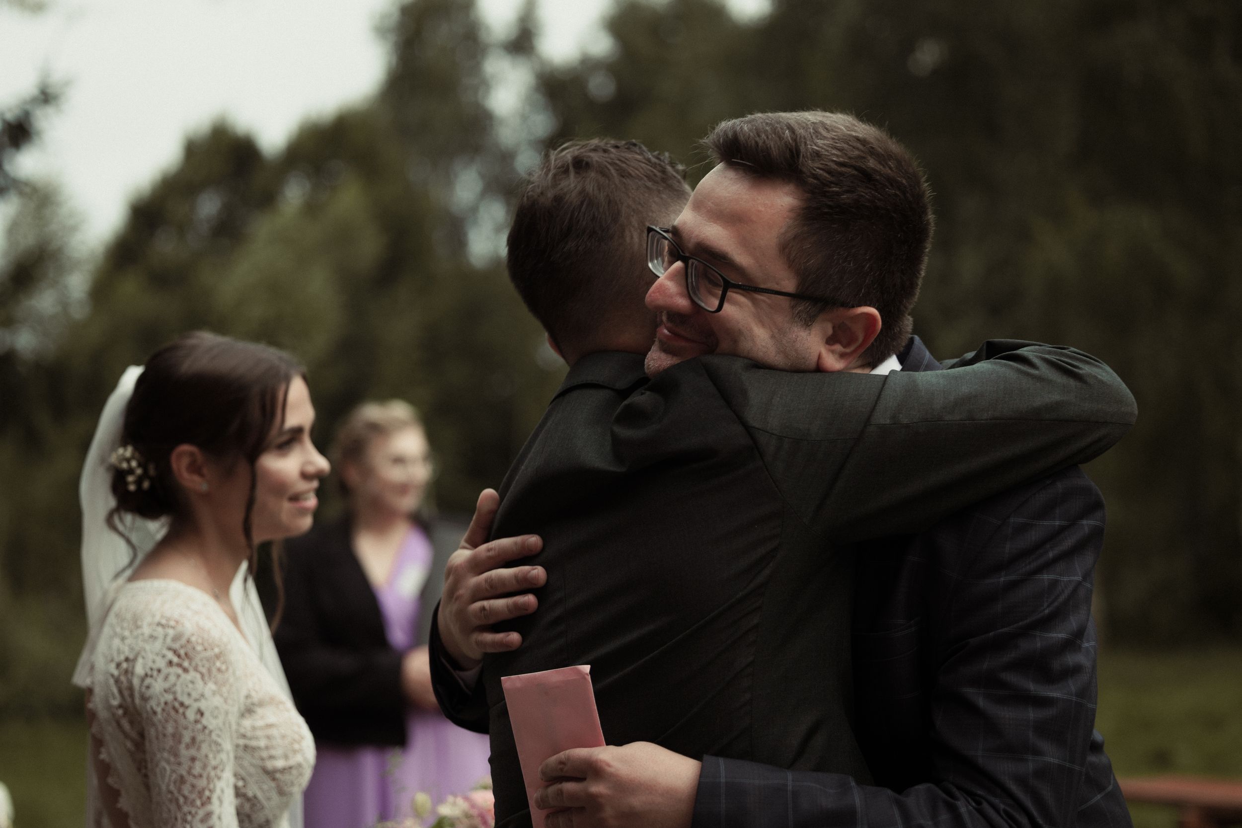 A series of wedding couples sharing romantic dance moves and joyful moments during an outdoor celebration.