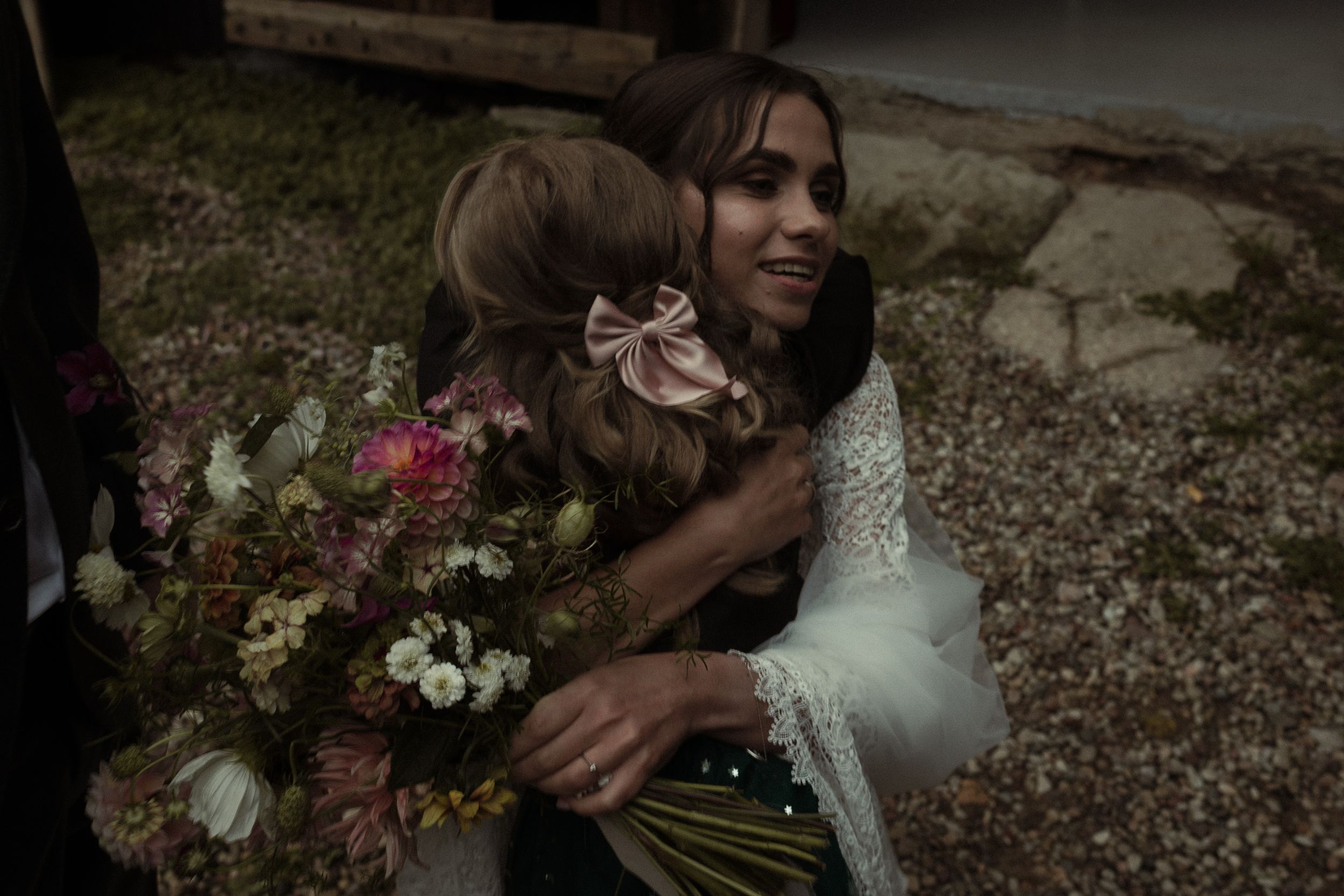 A collection of romantic moments at an outdoor rustic wedding celebration shown in a collage of six photos.
