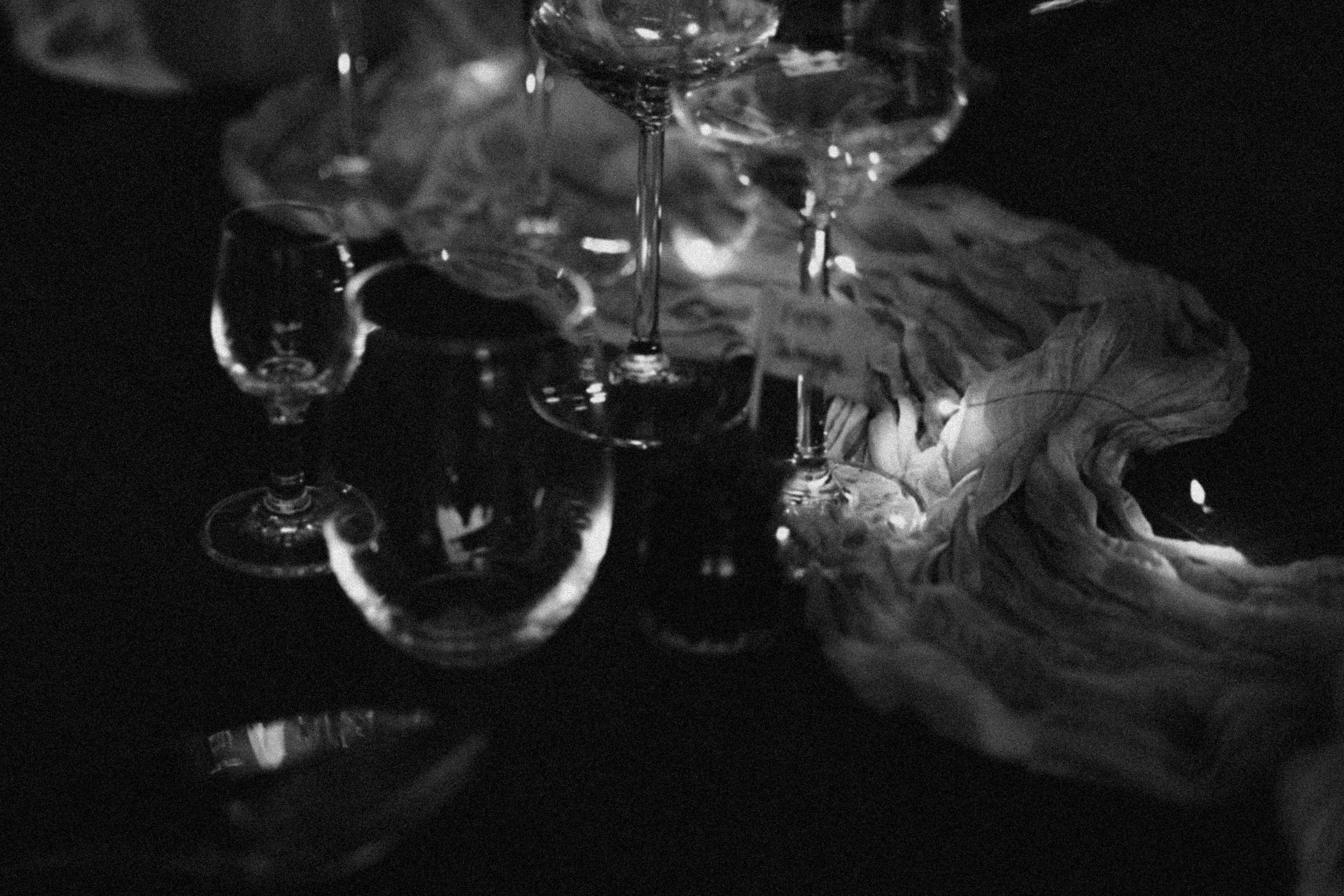 White smoke swirls elegantly against a black background creating an ethereal abstract pattern.