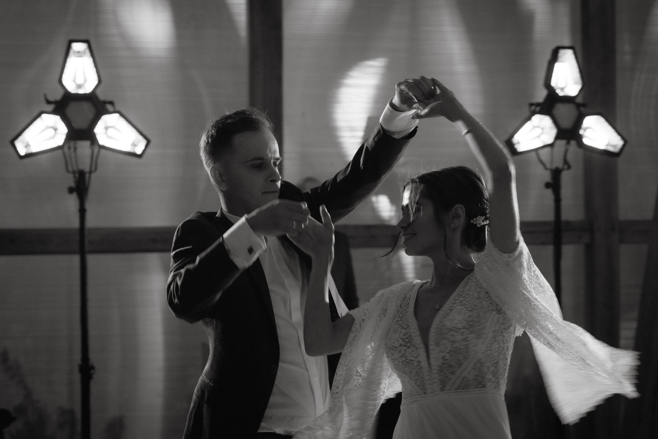 A black and white montage of wedding photos showing a bride and groom dancing and celebrating their special day.
