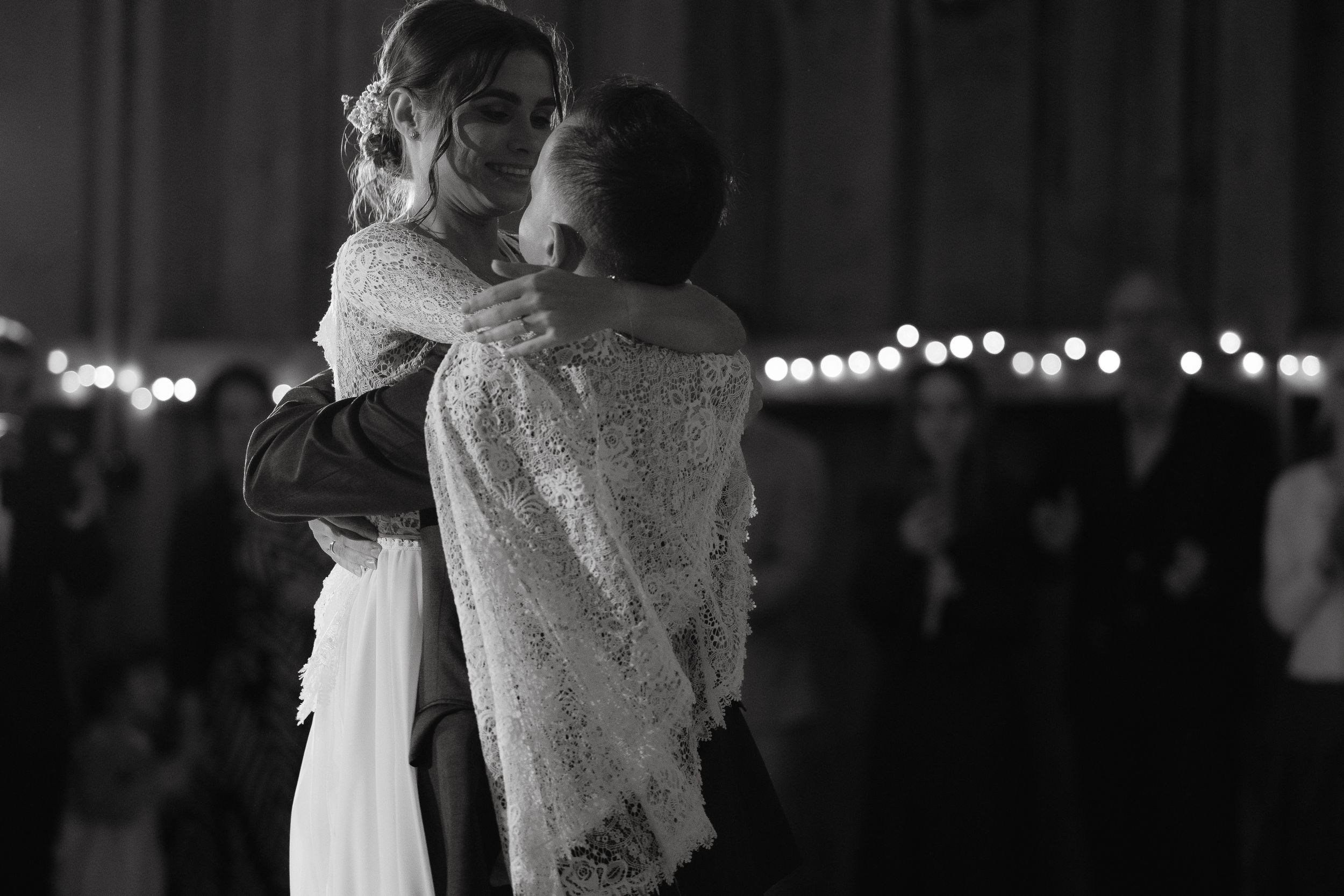 Black and white wedding photos show celebrations and dancing couples at a romantic evening reception.