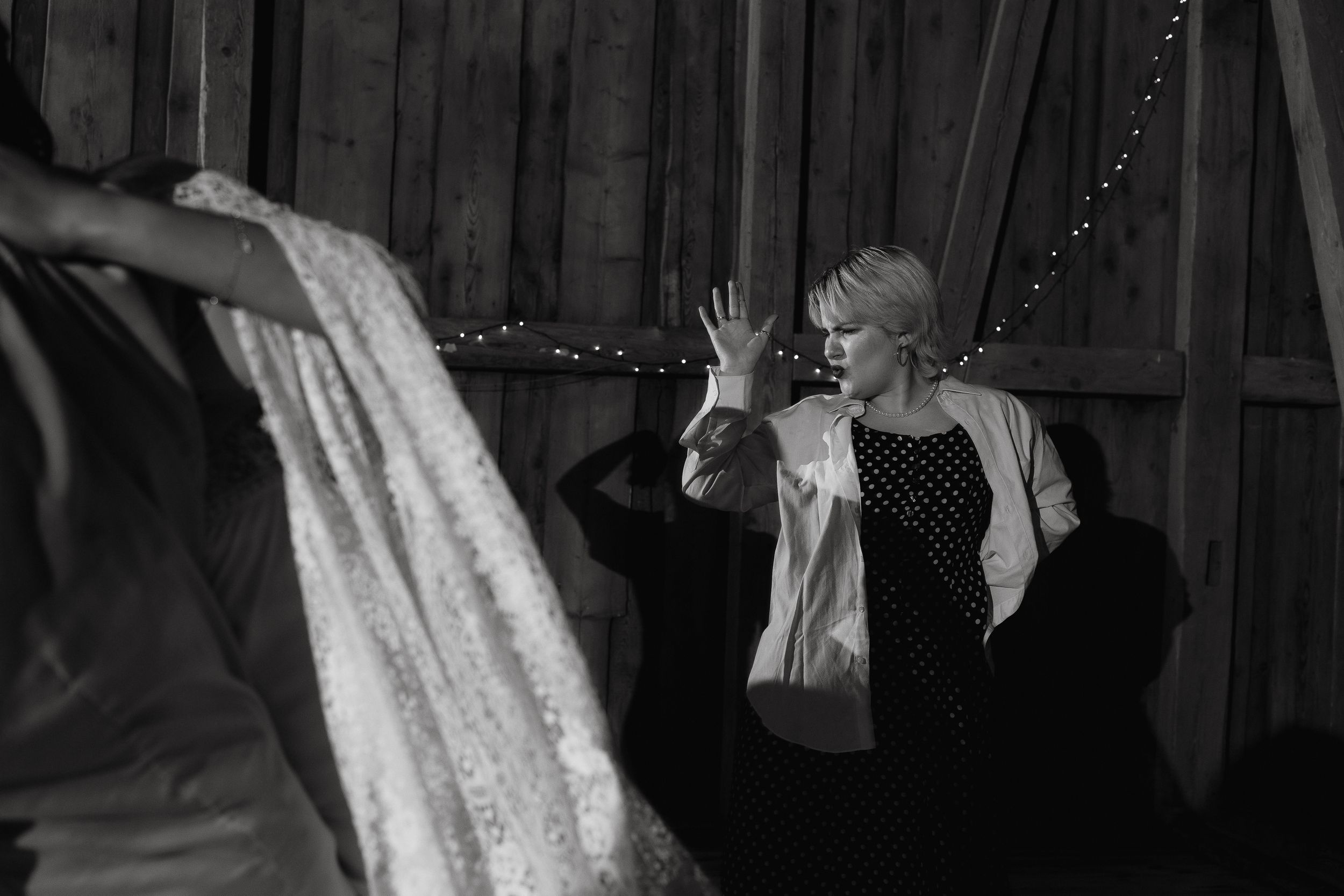 A series of black and white photos show people performing swing dance moves together in dramatic action shots.